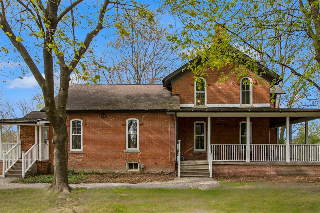 Beautiful farmhouse on nearly 3 acres in Ann Arbor Schools.  Built with rare triple-brick construction and highlighted by 10-foot beamed ceilings, this home combines historic character with modern comfort. The main floor features a primary bedroom and laundry, while the second floor offers four large bedrooms and a large, full bath. Recently restored, the home is move-in ready and full of potential.The 1,600 sq. ft. barn adds even more value, with hardwood floors, a new roof and furnace, new windows and doors, half bath, and a prep room with sink and refrigerator--perfect for gatherings, hobbies, or home business use.A unique property with space, charm, and endless possibilities.