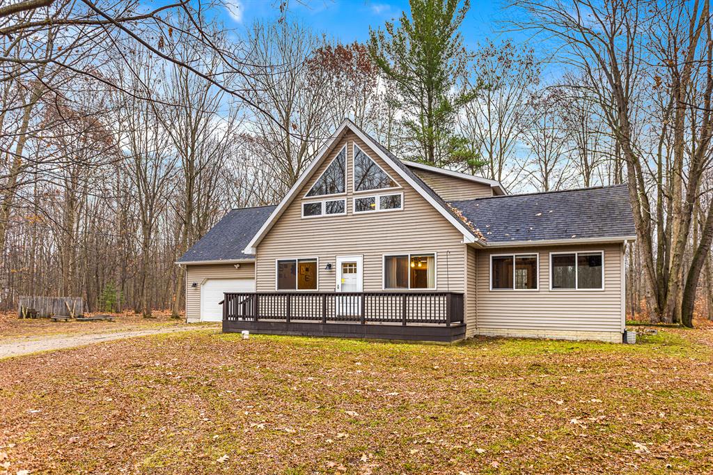 If you are looking for privacy,storage,and an open floor plan,we've got it!This home sits on a beautiful, fully wooded 10 acre parcel and includes a 30'X40' partially insulated pole barn.Entering from the 2 stall,heated garage, you immediately walk into your mudroom that is a perfect space to keep shoes/coats out of your main entryway.As you continue down the hall, the main floor bed and bath are situated just off the kitchen which includes a new Forno chef's range-just waiting to cook your next homemade meal!As you look out into the living area, you'll find cathedral ceilings as well as the  dining room and updated den area. With a full wet bar,it's perfect for entertaining and keeping guests out of your way while you're in the kitchen.As you walk upstairs, there is a loft style room that would be great as your home office or play area.The primary suite completes the second floor. Over the garage is a finished bonus room to convert to a bedroom, relaxation, or work space!