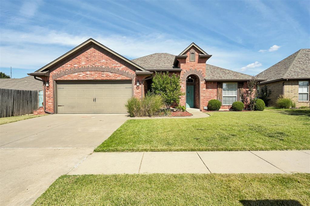 Curb appeal, charm, and a vibrant community lifestyle await you in this beautiful Grove home! The covered porch with stylish arches offers a great place to enjoy a cup of coffee or decorate for all the seasons and holidays. Step inside to find wood-look tile flooring throughout the main living areas, a stunning built-in that separates the dining from the living room, and elegant crown moulding with cased-in doors that give the home a custom touch. The open-concept kitchen is designed for both style and function, featuring a large island, pantry, granite countertops, gas range, and stainless steel appliances. The living room is made cozy by a gas fireplace. The primary suite is thoughtfully tucked away from the secondary bedrooms for privacy and includes dual vanities, ample storage, and a spacious layout. Out back, enjoy a covered patio with a mounted TV and gas hookup for grilling. Perfect for entertaining or relaxing evenings outdoors. A storm shelter adds peace of mind year-round and the sprinkler system offers easy maintenance for the lawn and garden. Living in The Grove provides you with great amenities and offers you access to two pools, clubhouses, fitness centers, walking trails, and sports courts. Located in Deer Creek Schools with OKC utilities, this home keeps you close to dining, shopping, and major highways. Fridge, TV on patio, and barstools can remain with home with acceptable offer.