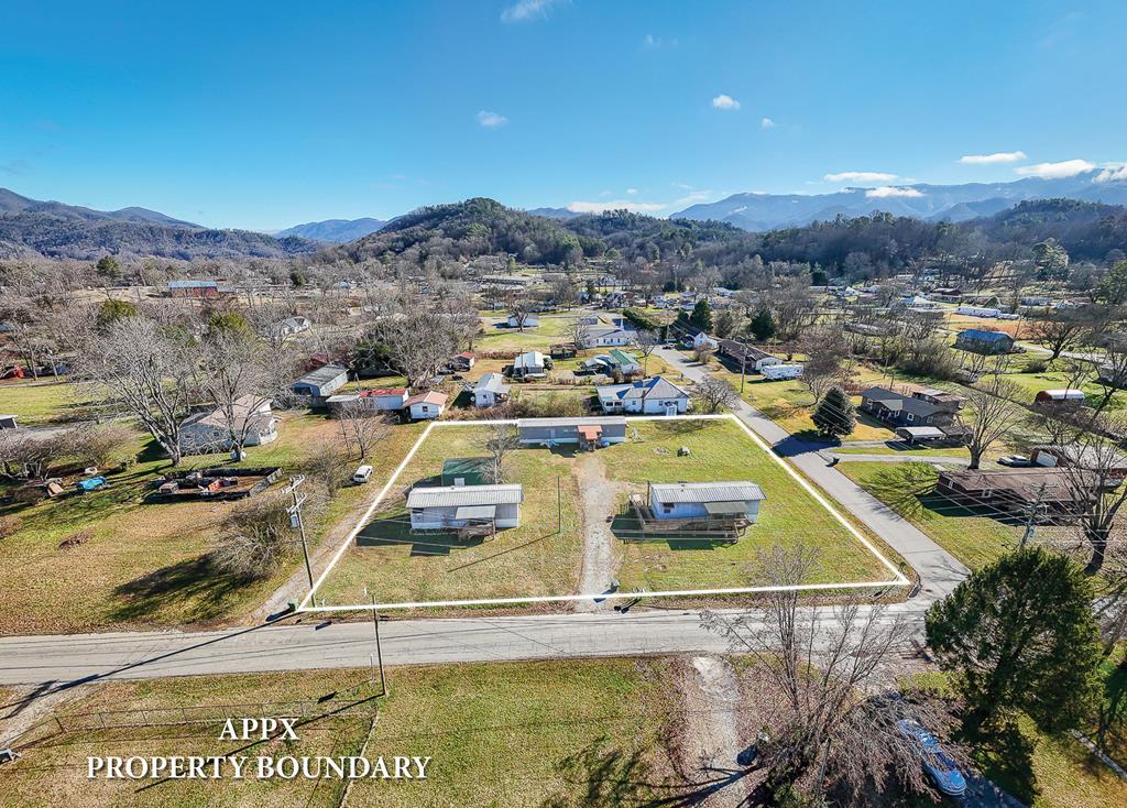 Great investment!  Generates $3750.00 per month!  Thats about a 20 cap!.  Located in a Andrews NC based Manufactured Home Subdivision / Community .  The property is just minutes away from downtown Andrews and all of its amenities, 100 miles west of Asheville, NC, and 125 miles northeast of Atlanta, GA.  Andrews is currently undergoing a strong growth period, and this stabilized park which contains 4 rental lots, consisting of 3  Mobile Homes and one 24x24 storage building providing 4 discrete income producing units and  is ideal for long term housing investors.  2 of the homes were manufactured in 2001 and the other is older.  All three of them have been upgraded to insulated roof panels, which provides super energy efficiency.  Month to month, rent-only.  At 100% occupancy, tenants are paying $3750.00 per month including the storage building at $300.00 per month which is 45,000.00 total annual .  Tenants are responsible for power, water, and internet. The privately maintained driveways are paved/gravel and in average condition.   Considering the overall condition of the park, this manufactured home community is being offered as a stabilized investment, with roughly an 20%+/- CAP at full occupancy and with all properties rented based on current rent rates.  Seller is licensed realtor and managing member of accent awnings inc