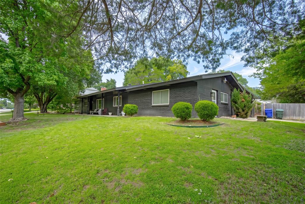 FANTASTIC 5 BEDROOM, 3 BATH HOME WITH POOL! – WALKING DISTANCE to the OU Baseball Field, Lloyd Noble Center, OU Law Center, and the OU Campus. Absolutely PERFECT for large or blended families, OU students, VRBO, or AirBnB opportunities! A striking Mid-Century Modern design, large corner lot, and inviting covered front porch welcomes you to a spacious floor plan featuring two living areas, bright windows, bamboo flooring, crown molding, and a cozy fireplace. You will LOVE the large, updated kitchen complete with breakfast bar, pantry, granite countertops, tile backsplash, stainless-steel appliances, and beautiful white cabinetry. A massive sunroom with big windows, tile flooring, and wet bar provides additional space for relaxing, studying, or entertaining! The primary bedroom suite offers an ensuite bath with double vanity, walk-in closet, walk-in tile shower, AND a tranquil soaker tub. FOUR additional oversized bedrooms are conveniently arranged in a split floor plan, along with two full secondary bathrooms. Friends and family will enjoy gathering under the large covered back patio and soaking up sunshine around the MASSIVE inground swimming pool with diving board! The backyard oasis is complete with a firepit, mature trees, and plenty of space to run and play—a PERFECT place to relax and entertain! HVAC upgraded 2020. High rated and sought after Norman schools close by!! With convenient highway access and a short walk to some of OU's BEST amenities, this incredible home offers endless possibilities and memories that will last a lifetime. Schedule your private tour today!