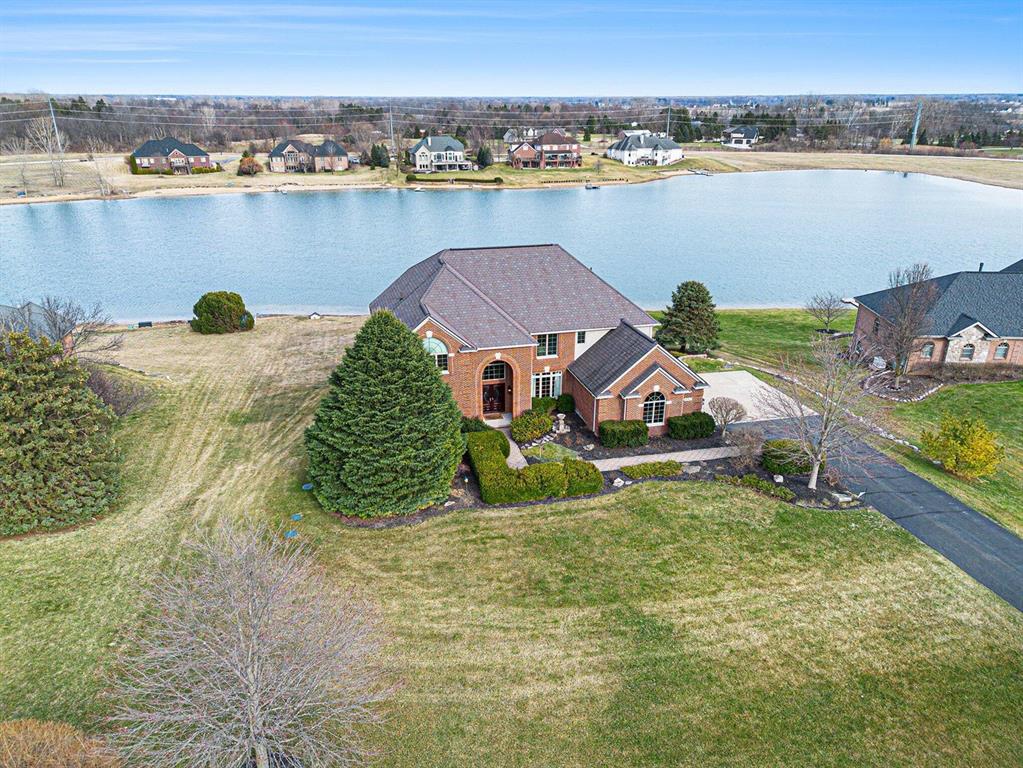 This custom built home rests on one of the most picturesque water front settings you see in the greater Ann Arbor area.  You will love the year-around water activities on this pleasant, no-wake lake that allows electric motor boats, swimming, fishing, and ice-skating.  The one-acre lot features an expansive backyard and great landscaping plus a large deck , patio, and screened porch, perfect for summer nights.  The interior has been nicely updated and perfectly maintained with over 4000 sf of living space on two levels.   Highlights include a welcoming two story foyer, Great Room with wall of glass to lake, open concept kitchen with custom cabinets, granite counter tops, and professional grade appliances plus a hearth room with fireplace, main floor den with built-in desk space, large formal living and dining rooms and an oversized backhaul mud-room and laundry room.  The upper level includes an expansive primary bedroom suitewith sitting room and lots of windows overlooking the lake, two walk-in closets, and a spa-like primary bath with travertine stone, two vanity areas, and large walk-in shower, a 2nd bedroom suite with updated private bath, and 3rd and 4th bedrooms that share an updated jack and Jill bath.   The walk-out basement is unfinished and provide ample storage space and wonderful additional living space.     This is an incredible home.