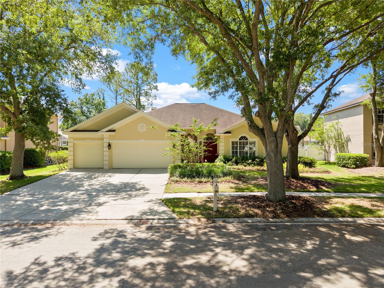 Located in the Hunters Green community, this 4 bedroom, 3 bath home with 3-car garage is set on a tree-lined street and offers a functional layout with formal living and dining rooms plus a dedicated office. Interior features include remodeled bathrooms, granite kitchen countertops, and a reverse osmosis system. Roof replaced in 2013. The layout provides multiple living and dining areas with flexibility for work-from-home, guest accommodations, or additional hobby space. The kitchen opens to main living areas and overlooks the screened pool and backyard. The outdoor space includes a fenced yard, paver deck, and rescreened pool enclosure, supporting both everyday use and outdoor gatherings. Hunters Green is a gated, master-planned community with beautiful landscaping and amenities including a golf course, parks, playgrounds, tennis courts, sports fields, and walking trails. Located with convenient access to I-75 and Bruce B Downs Boulevard, approximately 4.5 miles to Moffitt Cancer Center and approximately 5 miles to University of South Florida. Nearby retail and dining options include The Shoppes at New Tampa, The Shops at Wiregrass, Tampa Premium Outlets, grocery stores, coffee shops, restaurants, and everyday services. Additional nearby outdoor destinations include Flatwoods Park and New Tampa Nature Park, offering trails, open space, and recreational amenities. Come see it today!