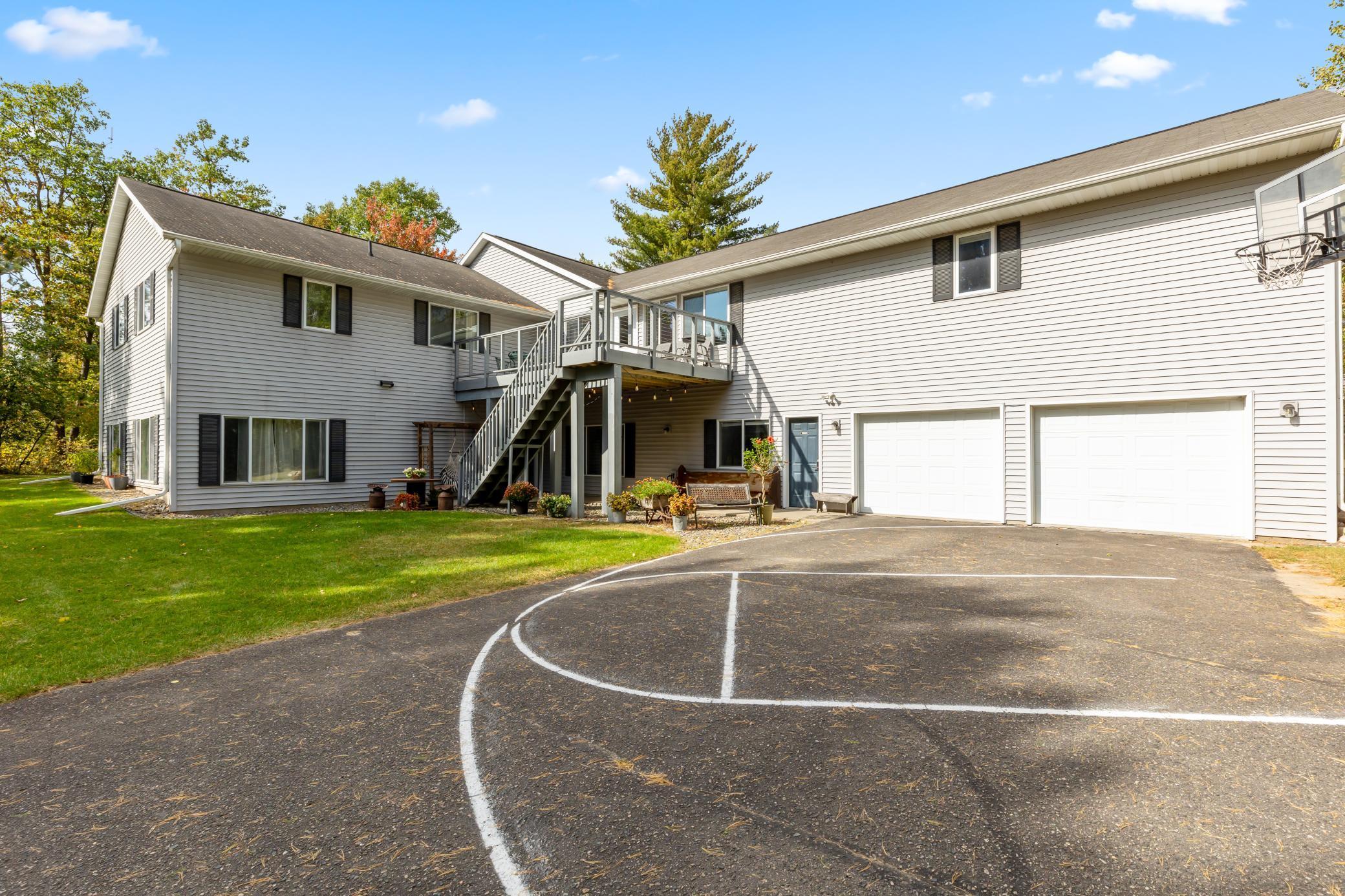 Incredible chance to own a 3 Unit Rental Property, with over 9700 sq ft,  located in the heart of Walker Minnesota, walking distance to public access of  Leech Lake, schools, library, restaurants, shopping, coffee shops, the Paul Bunyan Trail, grocery stores and so much more. This unique property has a total of 14 bedrooms, 13 bathrooms, and 4 car garage. There are 2 decks, 2 patios, and a lawn shed. The Main Floor Unit consists of 10 bedrooms, 11 bathrooms, full kitchen, full laundry, pantry, office, 2 car garage used as a game room.  Lower Level Unit A consists of 2 bedrooms, 1 bathroom, full laundry room, kitchen. Lower Level Unit B has 2 bedrooms, 1 bathroom, laundry in large utility room and completes with another 2 car garage. This property is being sold FULLY FURNISHED with appliances, beds, nightstands, tvs, end tables, accent chairs, dining room table, chairs, couches, bedroom linens, and bathroom towels.  Every bedroom has its own temperature controlled  heat. Lawn has a sprinkler system. Property is designed to access every unit through a set of internal stairs with secure entry or you can use the separate driveways. This is truly a TURN KEY business. A must see! Dreams of owning your own AIR BNB. VRBO, RENTAL UNITS, EVENT CENTER, ASSISTED LIVING, WELLNESS/TREATMENT CENTERS…… the possibilities are endless with this property.