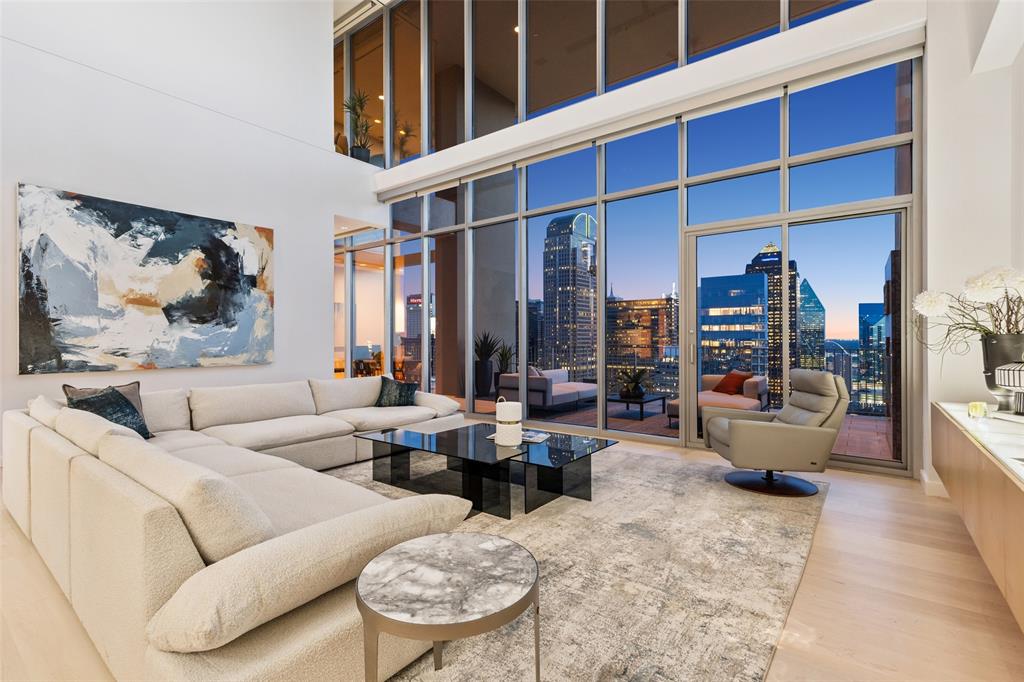 Landmark Dallas Arts District penthouse at One Arts Plaza overlooking Downtown, Trinity River, Uptown, North Dallas and Fair Park with unobstructed views in three directions. Full service building with valet parking and concierge. Ground level plaza features restaurants including award winning Tei-An for Japanese fusion. Walking distance to museums, symphony center, area restaurants and Klyde Warren Park. Penthouse selected by Cantoni to showcase their furniture and art which is available for separate purchase, or work with their designer to customize the interior to your own taste. Three assigned parking spaces are the best in the building surrounding the residential elevator entrance. Secure storage unit convenient to loading dock by freight elevator. Interior of home features 23 foot ceiling height in living room, Lutron lighting system with customized settings and all-off feature, catering party optimized kitchen, private interior elevator, floor-to-ceiling glass, electric Lutron blinds, abundant storage inside and out, hobby room, crow's nest study, sound system wiring. This penthouse is a rare find that is both visually stunning but with a thoughtful layout for comfortable living and entertaining.