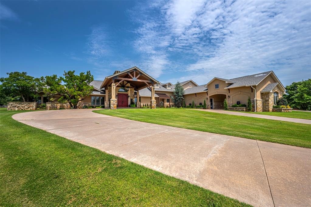 Exquisite home on 5 acres at Coffee Creek and Santa Fe in Woodhill Addition.  Home includes a cabana with outdoor kitchen, sparkling pool, 658 sq. ft. pool house not included in the sq. ft. with a full kitchen, bath, a wet dry sauna, and the pool table stays, sport court for tennis, pickle ball, basketball and shuffleboard, and a 404 sq. ft. workshop. Larger workshops are allowed. Horses and barns are also allowed. A circle drive and porte-cochere, and a 4-car side garage leaves plenty of room for extra parking. The sprinkler system covers the 5 acres, and it along with the pool are on well water. The house is on City of Edmond water and utilities. There is a formal living room, study/library, family room, music room, hobby room with exterior ventilation, workout room, and an additional sitting area off of guest bedroom. There are 4.5 baths in the main home, and one in the pool house. All bedrooms are large with access to a bathroom. Bedrooms 2 and 3 share a Jack and Jill bath with an additional laundry facility. One bedroom and bath are upstairs. Inside you will find soaring, beamed ceilings, wood flooring, and lighted insets to display your artwork. There is a double-sided fireplace between the living and formal dining. A butler's pantry off of formal dining will hold all of your beautiful glassware. There is a large media room with a projector and screen that stays with the home. Truly a chef's gourmet kitchen with Wolf, Sub Zero, and Kitchen Aide appliances. The primary suite has a cozy fireplace, his and her closets, a double vanity, a makeup vanity, beautiful soaking tub, and large walk-in shower. Tons of storage in this home including 1900 sq. ft. of storage off of the upstairs landing. Storm shelter. The house and cabana got a new roof in October of 2025. This home was originally built in 1978. After a tornado hit, it was added on to and approx. 2/3 of the house was redone in 2012. Blueprints available.  This home has been well loved and will be missed.