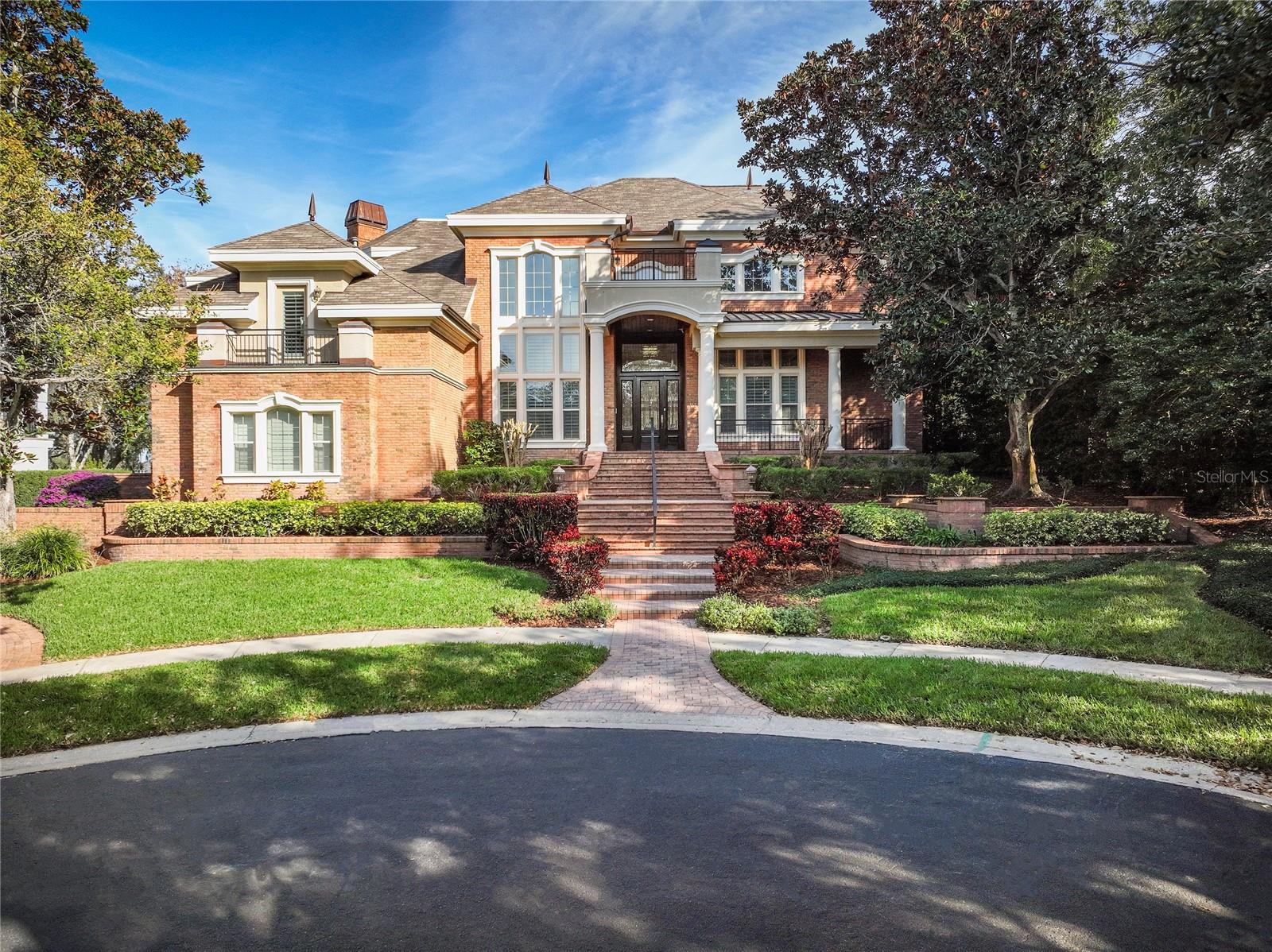 An impressive golf front, brick home infused with traditional elements that build a legacy of warmth and comfort! Timeless design & attention to every detail! Enjoy golf course views of Innisbrook Island Golf Course. 24 hr guard gated community. Quality multi-story brick construction w/superb craftsmanship on .48 acres. Cast stone trim. Copper gutters & flashings. Azek moisture resistant fascia. Elevator access to all levels. Newer a/c’s. Whole house Generac generator. 2017 roof. Samsung Smart Things Home automation system. Guardian Security System with cameras. Fabulous outdoor living with covered lanai, gas fireplace, separate gas fire pit, outdoor kitchen, heated pool & spillover spa w/ pop up valet cleaning and salt chlorinator. Grand marble foyer w/winding staircase. Formal dining room with Butler’s Pantry. Formal living room with gas fireplace. Island kitchen boasts updated granite countertops, abundant custom cabinets, Wolf gas cooktop, double ovens, prep sink, R.O. filter, walk-in pantry, breakfast bar & separate breakfast room. Family room w/gas fireplace & wet bar. Opulent office w/custom crafted solid oak walls, ceiling, floors, & built-ins, shares a 2-sided fireplace w/the living room. Fabulous 2nd floor master retreat w/two walk-in closets, coffee station, gas fireplace, sitting area, second office, wrap around balcony, & a must-see magnificent spa bath w/steam shower and two water closets. Large resort sized guest suite/bonus room. Two additional bedroom suites. The addition of an attached 5th BR suite with kitchenette in 2017, currently used as an exercise room, would also be an ideal in-law suite. Sound system throughout. Central vacuum. Oversized 4 car garage with workshop and My Q app control for garage cameras and doors. Community gate to Innisbrook Golf Resort w/6 pools, 3 world class golf courses, tennis courts, pickle ball courts, fitness center, and full-service spa. Minutes to powder sand beaches & easy access to Pinellas Bike Trail just outside the community.