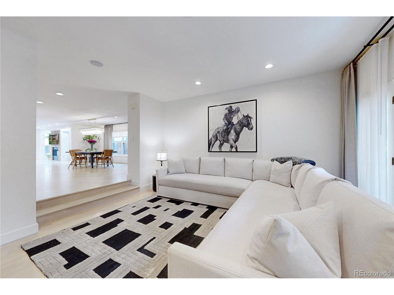 Tucked into one of Cherry Creek North's most sought-after blocks, this beautifully remodeled townhome invites you to slow down and settle in. Step inside and you're greeted by custom-cut white oak herringbone floors flowing throughout the main level - the kind of detail that makes every day feel a little more special. The heart of the home is a chef's kitchen made for gathering, with custom white oak cabinetry, waterfall Cristallo Quartzite countertops, and a suite of top-tier appliances, including a 48-inch Thermador range. Just beyond, the homeowners have installed two new custom gas fireplaces, framed in fluted white oak, anchoring both living spaces with warmth and style. A three-panel bi-fold door opens the main floor to seamless indoor-outdoor living - ideal for summer evenings or quiet mornings with coffee. Upstairs, the primary suite feels like a private retreat: a spa-inspired bath with a soaking tub, heated floors, and a spacious custom closet designed to keep life organized and calm. The secondary additional bedroom opens onto two balconies, offering a personal outdoor escape. Downstairs, a fully finished basement adds even more room to live and entertain, two laundry areas, and generous storage space. Thoughtful mechanical upgrades - including a tankless water heater and whole-house humidifier - bring comfort and ease to everyday living. And for those who love their vehicles, the garage's newly epoxied floor soaring 15-foot ceiling leaves room to imagine, with space for a lift and up to four cars. This is the only unit with an attached garage in the complex. This is more than a home - it's a place to gather, unwind, and truly live well.