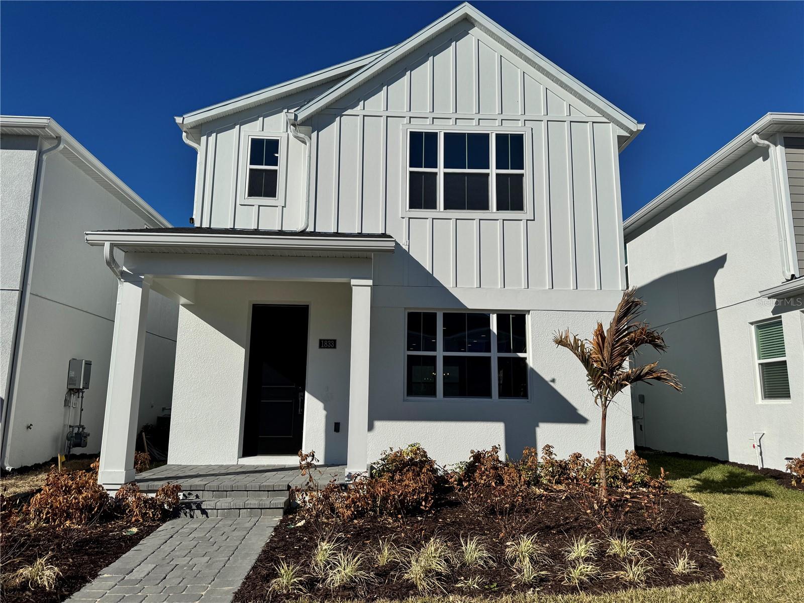 Stunning Toll Brothers Liston Modern Farmhouse located in the sought-after Bronson Peak community. This thoughtfully designed home offers exceptional flexibility with a 3-bedroom main residence plus a private apartment above the garage, ideal for multigenerational living, guests, or work from home space.The main home features an open-concept first floor with a light-filled great room, casual dining area, and designer-appointed kitchen showcasing quartz countertops, stacked cabinetry, stainless steel appliances, and upgraded finishes throughout. The seamless layout is perfect for everyday living and entertaining alike. Three well-appointed bedrooms in the main home provide comfort and privacy.A standout feature of this home is the separate apartment above the garage, complete with its own private entrance, loft-style living space, bedroom, full bath, and dedicated A/C system—offering true independence and versatility rarely found in new construction.Additional highlights include 8-foot interior doors on the first floor, upgraded flooring, modern black hardware and fixtures, and Toll Brothers’ signature craftsmanship throughout. Located in a growing Apopka location with convenient access to major roadways, shopping, dining, and outdoor recreation.Schedule your private tour today and experience the craftsmanship that make this Toll Brothers home truly exceptional.