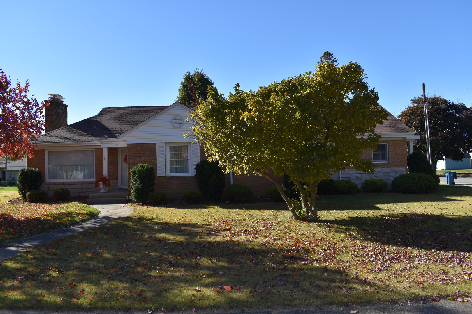 Don't Let This One Get Away - Spacious Ranch on a Corner Lot in Flanagan! Welcome to 501 S Main St., Flanagan, IL - a beautifully maintained brick and vinyl ranch-style home situated on an extra-large corner lot in a quiet neighborhood. This inviting home features: 3 spacious bedrooms, two with direct access to a 19' x 16' concrete patio - perfect for morning coffee or evening relaxation. 2 full bathrooms, A cozy living room with a gas fireplace, Kitchen with breakfast nook, plus a formal dining room, laundry room, mud room, and a versatile bonus room. A massive 26' x 36' attached two-car garage with patio access, Garden shed for extra storage, Partial unfinished basement offering ample storage space. Recent updates include a Trane furnace (2016) and a gas water heater (2018). The home also features a hook-up for a portable generator, adding peace of mind during storm season. Whether you're looking for space, comfort, or a place to entertain, this home has it all. Schedule your showing today - this gem won't last long