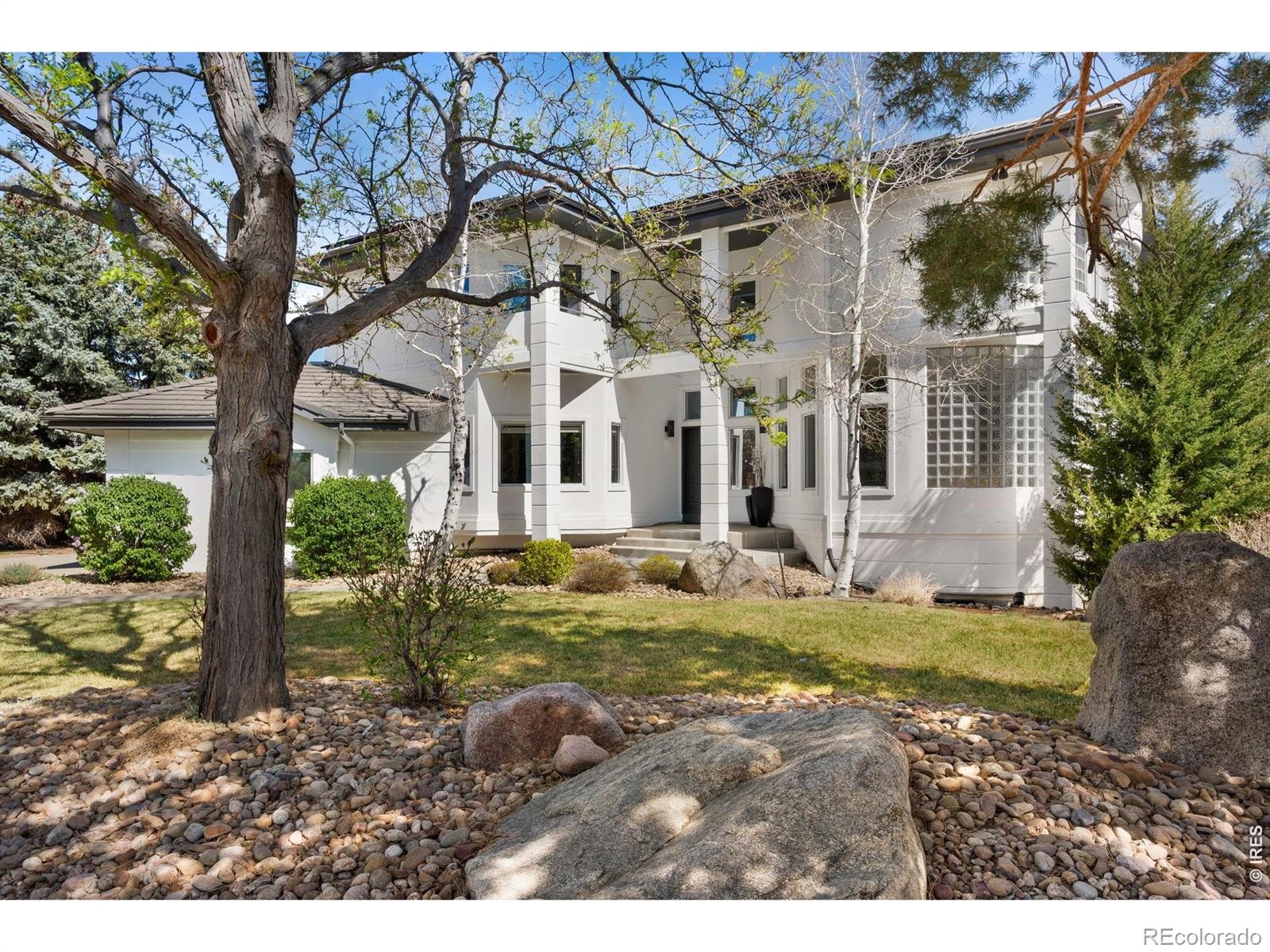 This stunning single-family home offers 5,423 square feet of thoughtfully designed living space with six bedrooms and six bathrooms. Four bedrooms are located on the upper level, including the expansive primary suite-a true sanctuary featuring a double-sided fireplace and a luxurious spa-inspired bathroom. One secondary bedroom enjoys an updated en-suite bath, while two additional bedrooms share another beautifully updated full bathroom. The remaining two bedrooms are located in the lower level, both with daylight windows and a convenient Jack-and-Jill bath.With soaring ceilings and abundant windows, the home is filled with natural light, creating a warm and welcoming atmosphere throughout. At the heart of the home is the renovated chef's kitchen, showcasing high-end finishes, an induction cooktop, and generous space for cooking, gathering, and entertaining. From casual meals to special occasions, there are numerous places to come together, whether dining in the formal dining room or enjoying outdoor meals on the back deck.The finished walk-out lower level expands the living space with a family/rec room featuring a wet bar, an electric fireplace, an additional bathroom, and flexible space for recreation, hobbies, or media.Outdoor living is equally inviting, with a large private yard and multiple decks offering wonderful spaces for relaxing, gardening, or entertaining. The home backs directly to Purple Playground Park, providing open views and added privacy with no immediate rear neighbors. The Superior North Pool and Superior Elementary School are just a few blocks away. In addition to immediate community amenities, the Marshall Mesa Trail System is easily accessed from this home.Blending comfort, sophistication, and generous living spaces, this exceptional Superior residence offers an outstanding opportunity to enjoy both elegance and everyday livability.