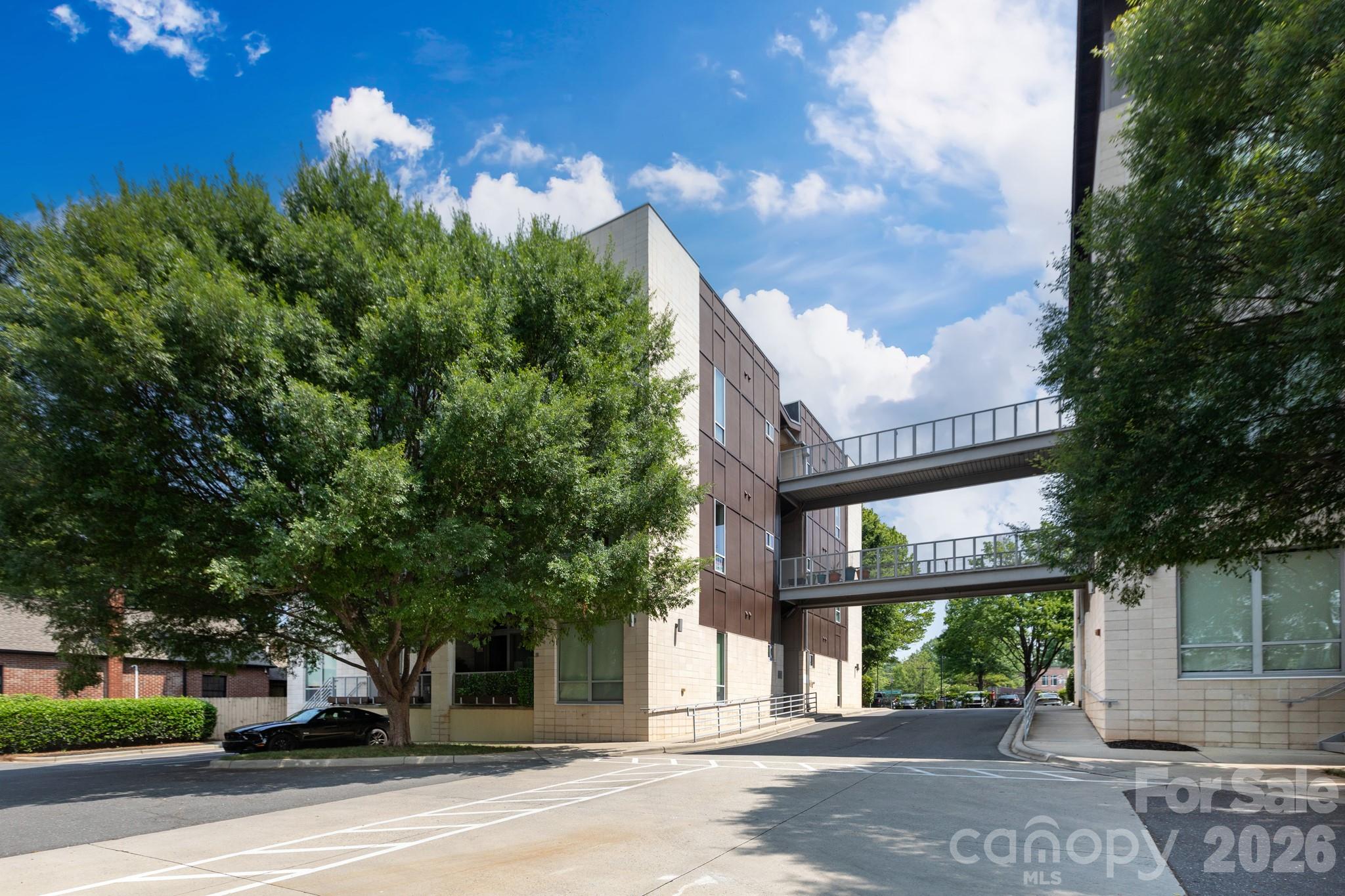 Located in the heart of vibrant Plaza Midwood, this stylish corner-unit condo offers an ideal blend of character, natural light, and urban convenience. 12-foot ceilings and dramatic floor-to-ceiling windows create an open, airy feel while filling the home with natural light. The thoughtfully designed one-bedroom, one-bath layout also features a dedicated laundry room and a private outdoor balcony. Just step outside your door and enjoy the energy and charm that make Plaza Midwood one of Charlotte’s most sought-after neighborhoods, with an incredible mix of dining, coffee shops, nightlife, shopping, and entertainment nearby.