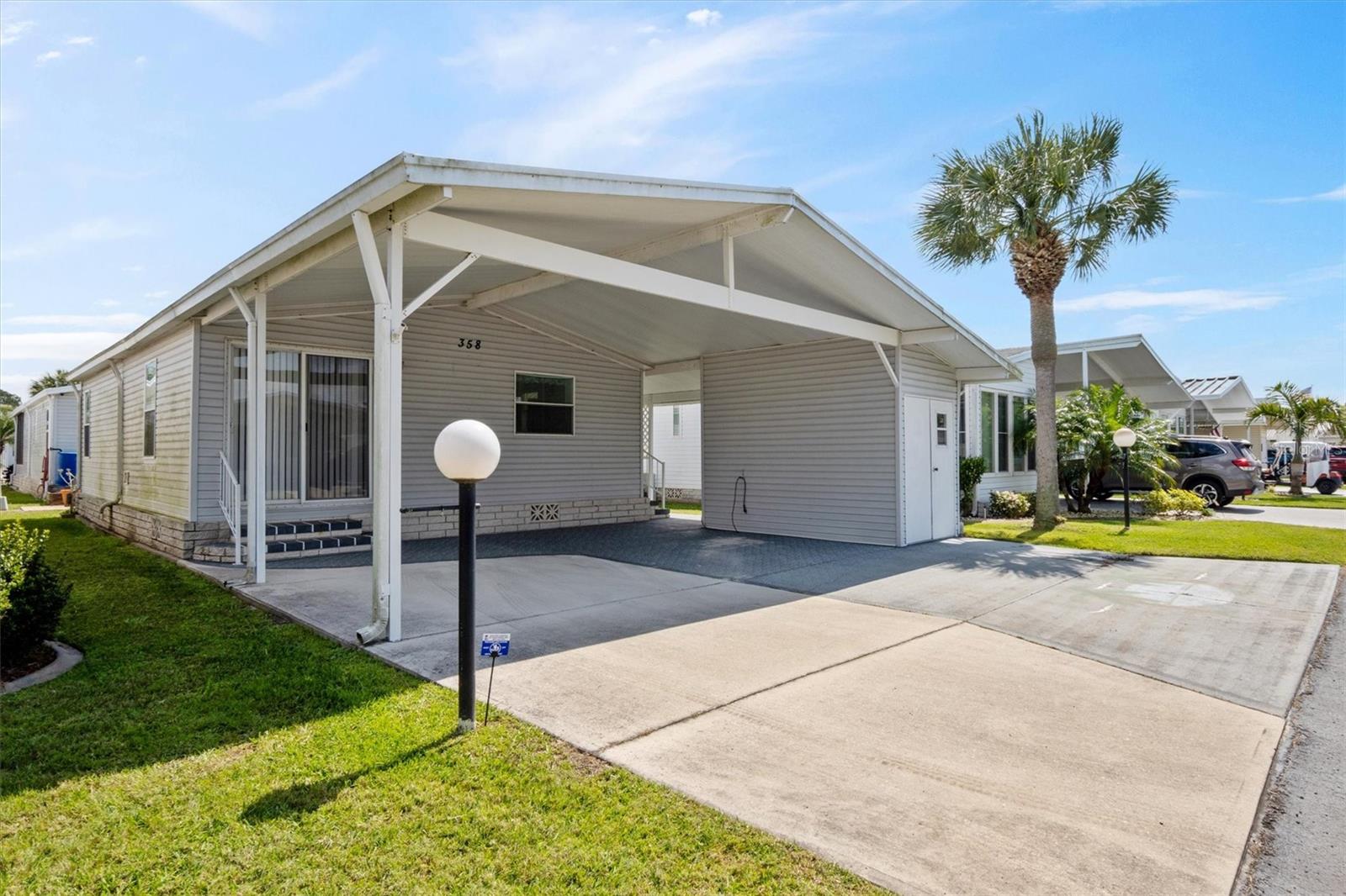 Florida ranch style home for sale with carport, image size:1600x1066