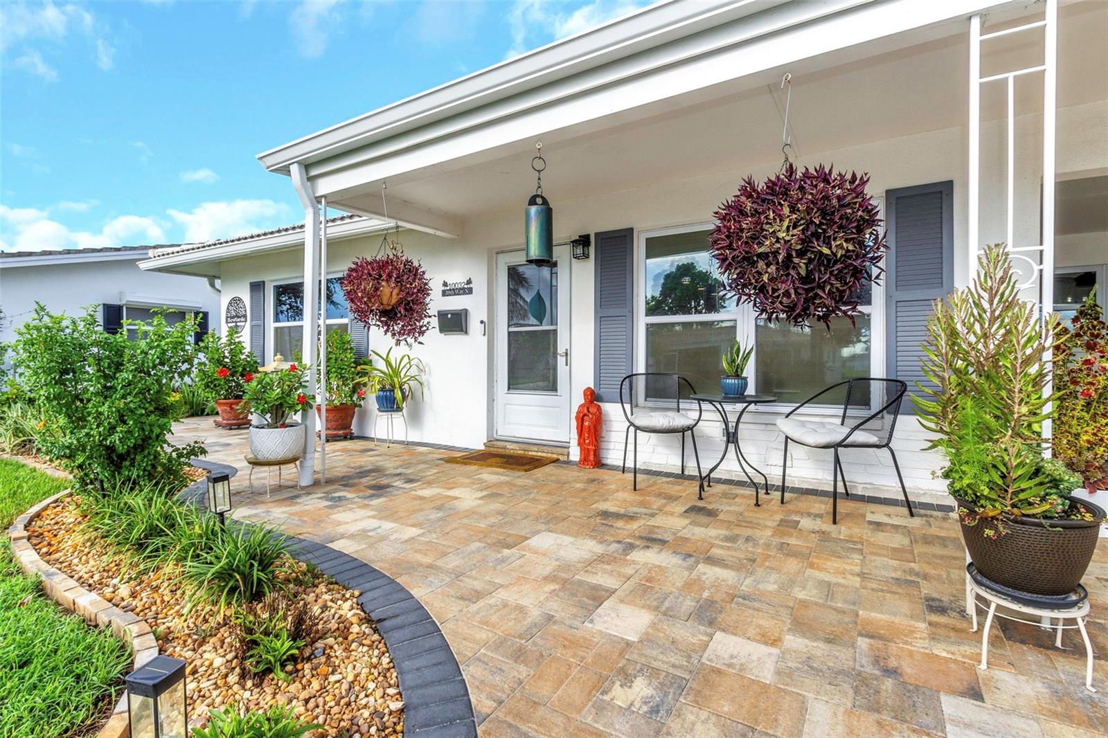 Welcome to this beautifully updated Carlton model in the friendly 55+ community of The Mainlands, Unit Three. This three-bedroom home is truly move-in ready and offers standout curb appeal with fresh landscaping, new paver pathways, a spacious rear patio, a double paved parking pad, and a charming covered front porch.

Inside, the open floor plan features a dream kitchen with a large island, quartz countertops, soft-close cabinetry, and brand-new stainless steel appliances. Easy-care wood plank tile flooring flows throughout the home, creating a modern and cohesive feel. The spacious dining area is perfect for family meals and entertaining. At the rear of the home, a versatile bonus room overlooks the backyard and makes an ideal den, home office, or guest space. This room also includes a convenient ensuite half bath combined with the laundry area. Two comfortable bedrooms and a fully renovated bathroom complete the interior.

This property truly stands out in a community where many homes look alike — offering unique updates and thoughtful touches inside and out.

Unit Three residents enjoy their own exclusive recreation area, featuring a clubhouse with meeting rooms, a stage, a full kitchen, and a library. Outdoors, there’s a large swimming pool, shuffleboard courts, and outside cooking facilities. A full calendar of social events, organized by the Unit Three Social Club, brings neighbors together for breakfasts, dances, bingo, and more.

The monthly maintenance fee of $477 covers water, sewer, trash, cable/internet, lawn care, irrigation with reclaimed water, exterior painting and pressure washing, and roof repair/maintenance — making this true maintenance-free living. The community also welcomes golf carts and up to two domestic pets.

Conveniently located off US-19, The Mainlands offers easy access to shopping, dining, downtown St. Petersburg, Tampa, and award winning Gulf beaches. Whether you’re seeking a full-time residence or a seasonal retreat, this home delivers the perfect blend of style, comfort, and Florida lifestyle.