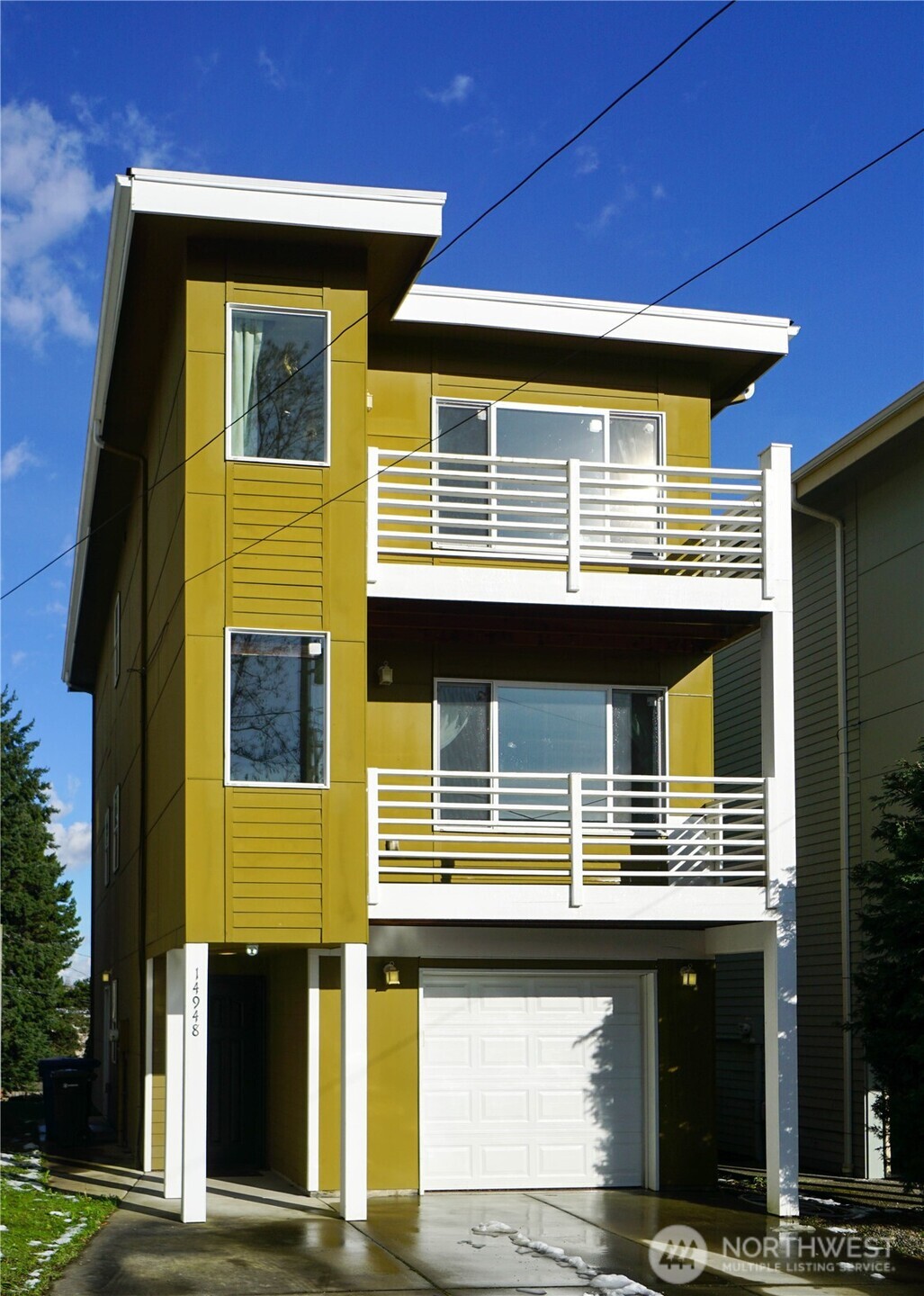 Commanding territorial view from this three story home. Two decks! One on the 2nd story and one on the 3rd.  Built in 2015, this contemporary design features an open kitchen floor plan with lovely breakfast bar, quartz countertops, stainless steel appliances and a gas range. The primary bedroom features it's own deck, walk-in closet and ensuite bathroom. Excellent proximity to SeaTac Airport and public amenities. Marvel at an occasional airplane silently gliding by, or take about a ten minute walk (two minute drive) to Mathison Park where you'll find paved trails, playgrounds, picnic tables, climbing walls, swings, slides and mountain views.
