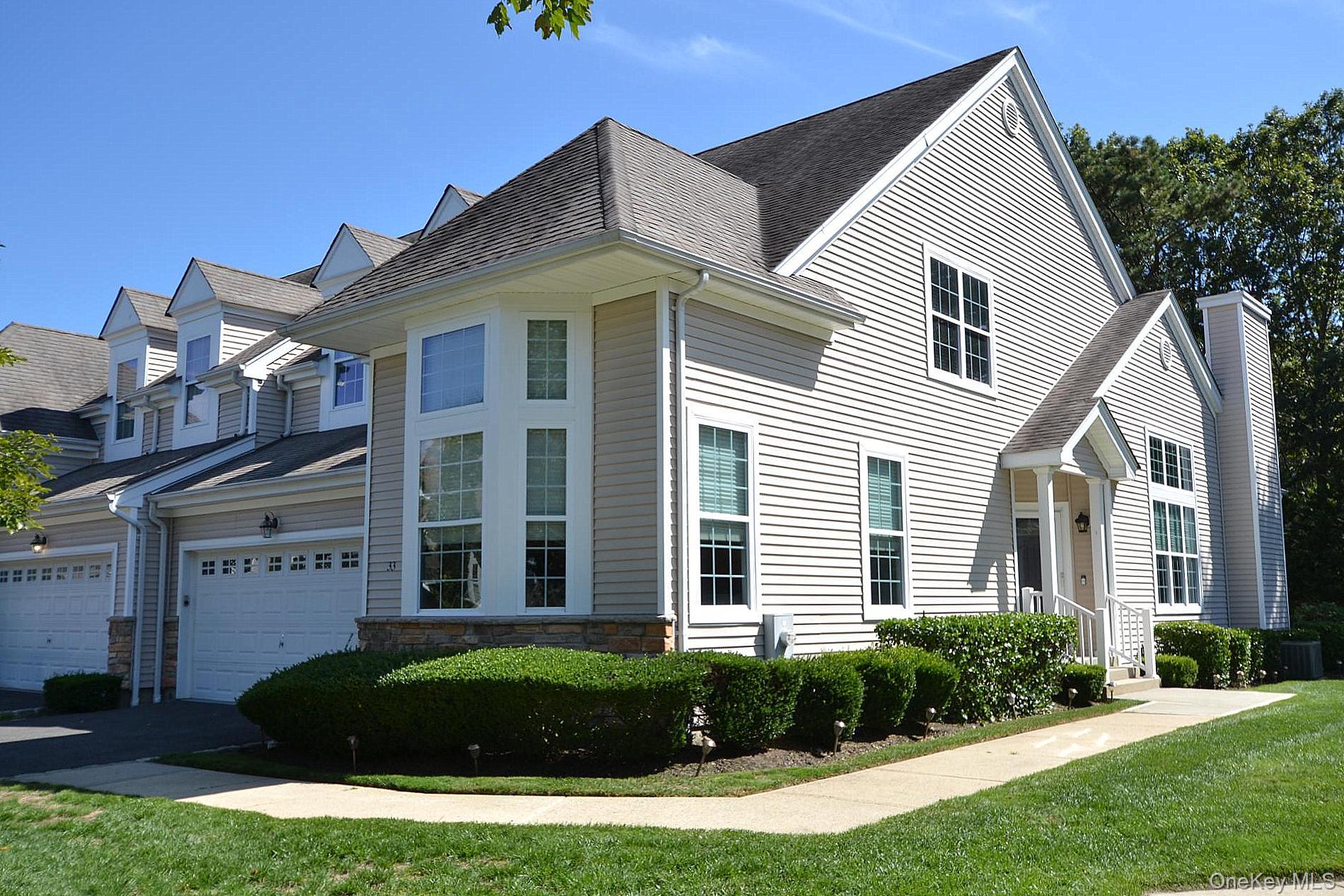 Stunning and meticulously maintained Beaujolais model offering over 2,600 sq. ft. of luxury living, including the 2 car garage, in a premier, gated, 55+ boutique community. This two-bedroom residence also 
features a spacious loft with family room and office/bonus room, along with three full bathrooms. Enjoy soaring and tray ceilings with custom 
paint finishes. Home also showcases an updated, contemporary kitchen 
featuring stainless steel Frigidaire Professional stove, microwave and 
dishwasher, plus a Frigidaire Gallery refrigerator. Other features include, 
but are not limited to, granite and stone finishes in all bathrooms, rain showerheads, and Jacuzzi tubs. The home offers an abundance of storage with walk-in closets, and a full basement with epoxy flooring. The Trex landing deck leads to a paver patio overlooking beautiful views and a 
walking path. Additional highlights include a gas fireplace with switch, 
two-zone gas heat, two-zone central air with dual condensers, hot water 
heater (2023), laundry room with stainless steel slop sink, alarm system 
hookup, Hunter Douglas window treatments with remote control, and a 
gas barbecue hookup (barbecue excluded). Community amenities 
include a clubhouse with yoga studio, gym, card room, kitchen, and great room, plus pickleball, tennis, bocce, and pool. Snow removal, landscaping, and water are all included, offering a low maintenance lifestyle. Truly pristine and move-in ready, this lovely home offers both elegance and comfort in a vibrant, active community.