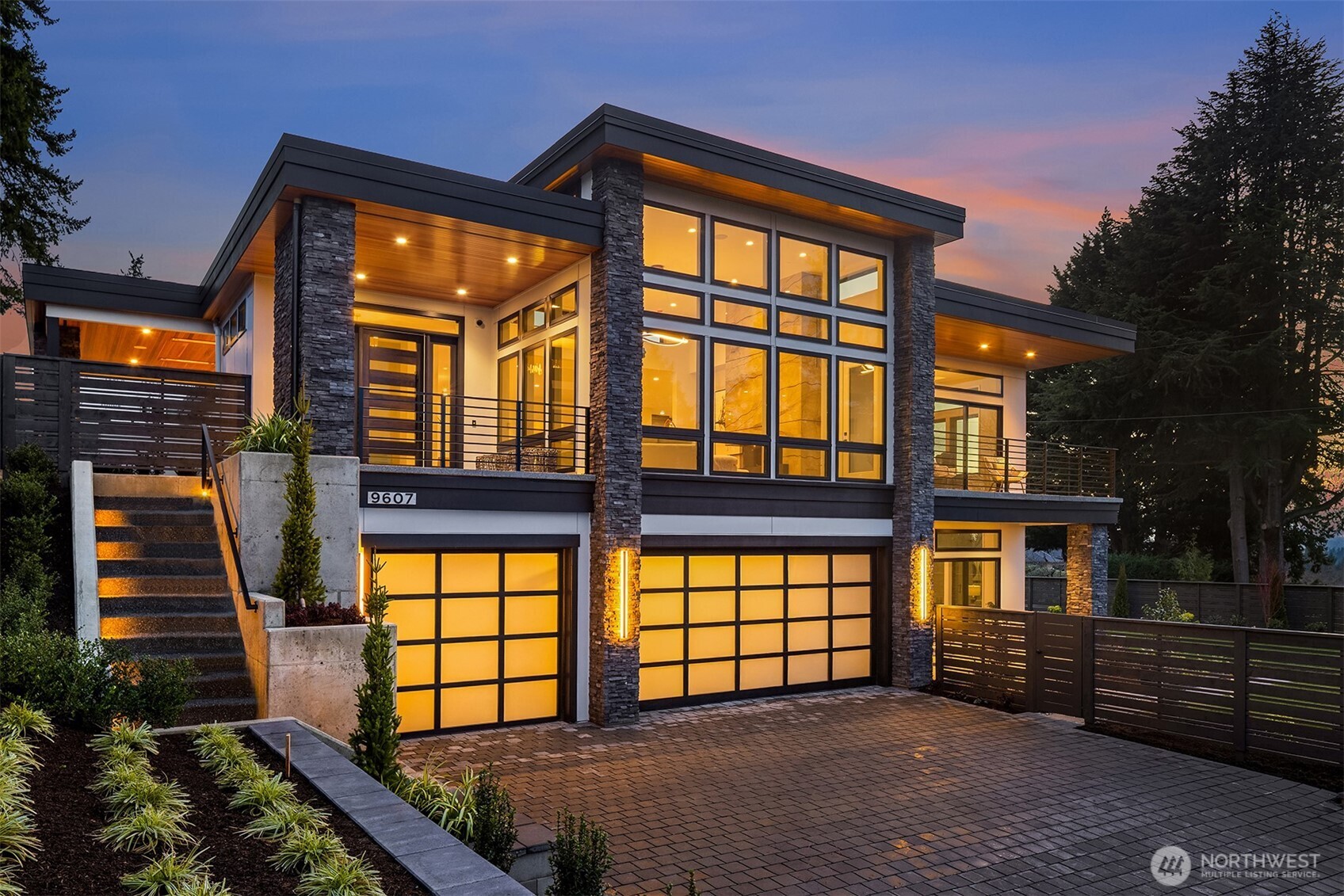 An exceptional new custom residence by John Buchan Homes, set in the coveted heights of Clyde Hill and designed to inspire. Walls of glass frame sweeping views, with sunsets stretching across the horizon. Light pours through expansive spaces, illuminating refined architectural lines and meticulously curated finishes. The floorplan balances openness with intention, ideal for elegant entertaining, meaningful gatherings, and focused work-from-home moments. Every detail reflects artisan craftsmanship and Buchan's 65-year commitment to enduring design. Privately positioned yet moments from Bellevue’s premier amenities, this is a home for those who lead, create, and operate at the highest level; a sanctuary that restores as powerfully as it performs. A rare opportunity to own a new custom residence in one of the Eastside’s most prestigious neighborhoods.