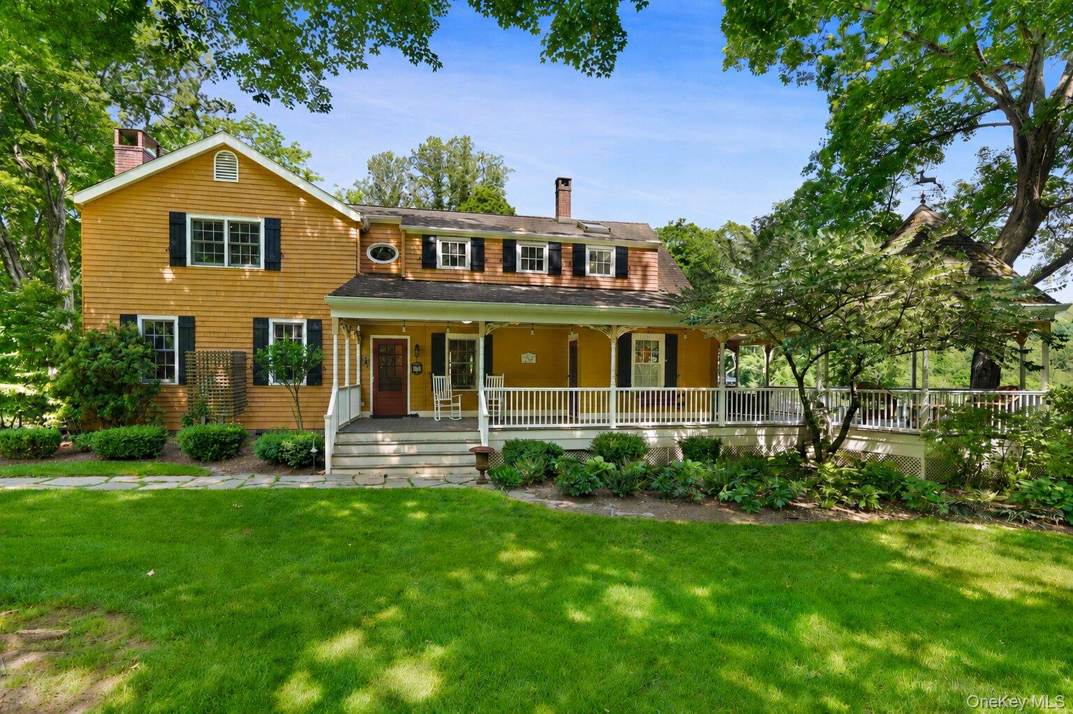 Set on two peaceful acres at the end of a private country lane, this distinctive 6 bedroom, 3.5 bath Colonial farmhouse offers a rare blend of history, charm, and natural beauty. Bordering the western edge of the Leon Levy Preserve, the property enjoys a tranquil setting surrounded by gardens, stone walls, and open green spaces.Originally built around 1900 as the caretaker's residence for the former Open Country estate, the home has been thoughtfully preserved to honor its heritage. Vintage materials and period details reflect a commitment to maintaining its original character while offering comfortable living for today.The property retains the feel of a classic early American colonial farm, complete with meandering gardens, a rustic root cellar, and chickens that add to its timeless appeal. Rich in history and full of personality, this is a special opportunity to own a piece of South Salem's past.