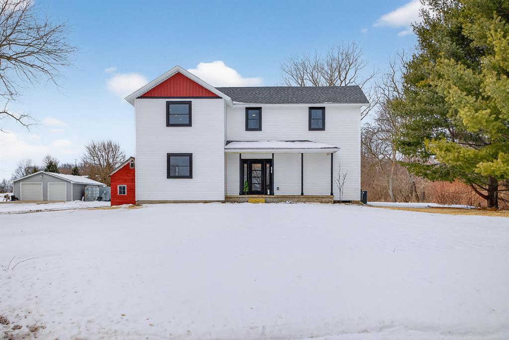 Welcome to 7900 Napoleon Rd, where timeless farmhouse charm meets a masterfully curated transformation. Taken down to the studs and rebuilt with intention, this residence offers the rare confidence of brand new systems and refined finishes throughout while preserving its original character. A gracious foyer welcomes you into a chef-inspired kitchen designed for effortless entertaining, flowing seamlessly into a spacious formal dining area. The inviting living room is anchored by the original fireplace, enhanced with an electric insert for year round warmth and ambiance. The main level primary suite is a private retreat behind elegant French doors, filled with natural light and complemented by a spa like ensuite featuring a stunning walk-in tile shower and exceptional storage. Upstairs, a cozy bonus family room adds versatility. Set on one acre with two barns, this property is ideal for elevated country living. Showings begin 2/18.