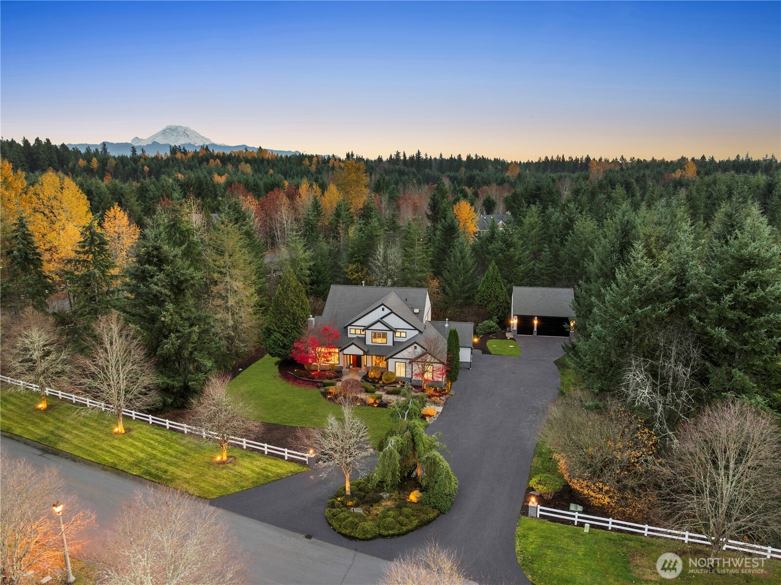 Discover an unparalleled custom estate in the coveted gated Ridge at Lake Sawyer. This true one-of-a-kind residence offers 4 beds, 4.25 baths and 5,210 sqft on 1.9 acres, complete with a shop and uncompromising high-end finishes throughout. Enter through an 8' pivot door into a chef’s kitchen with custom wood cabinetry, Thermador & Signature stainless appliances, Taj Mahal quartzite countertops, backsplash and hood, and an oversized waterfall island. The stunning primary suite is a spa retreat with dual vanities, freestanding tub, custom tile shower and bespoke walk-in closet. Italian plaster fireplaces, LED lighting, chandeliers, bi-folding living room door, and more. Lower level with second kitchen and living area. A rare offering!