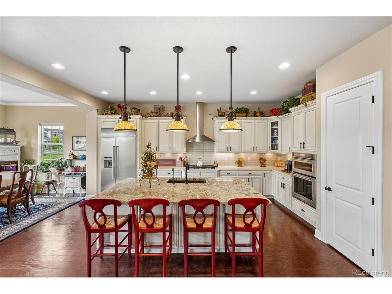 SPECIAL FINANCING! Seller-paid 2-1 buydown available-5.875% Year 1, 6.875% Year 2 and 7.875% thereafter (7.916% APR). Contact listing broker for details.* Welcome to this impressive ranch-style home in sought-after Southshore, offering more than 4,700 finished sq ft, a Brand New Roof (2026) and a fully paid-off solar system and exceptional indoor-outdoor living. Step inside to rich hardwood floors, exposed wood beams, soaring ceilings and a dramatic stone fireplace. The chef's kitchen features granite countertops, premium stainless-steel appliances, custom cabinetry and an oversized island, creating a natural gathering place for everyday living and entertaining. The spacious primary suite offers a private retreat with a spa-inspired 5-piece bath featuring a soaking tub and oversized walk-in shower. The expansive finished basement adds tremendous versatility with a large recreation area, theater room, fitness room and additional space for guests. Outside, enjoy a covered patio and beautifully designed xeriscape backyard with professional landscaping, fruit trees and raised garden beds-ideal for relaxing, entertaining and enjoying Colorado's outdoor lifestyle. Located just steps from the Aurora Reservoir and its scenic 8-mile paved trail, with convenient access to the Southshore clubhouse, pool, parks and trails. Located within the Cherry Creek School District. Ranch-style living. 4,700+ finished sq ft. Finished basement. Paid-off solar. Exceptional backyard. A standout opportunity in Southshore. Everyday Open House-call for dates and times. For added peace of mind, this home includes a 12-Month Home Warranty. Community Appreciation Benefits may also be available. Need to sell first? Our Buy This Home & We'll Buy Yours program can help you avoid owning two homes. Contact the Listing Agent for details and discover how you can move up with confidence! *rates are subject to change.