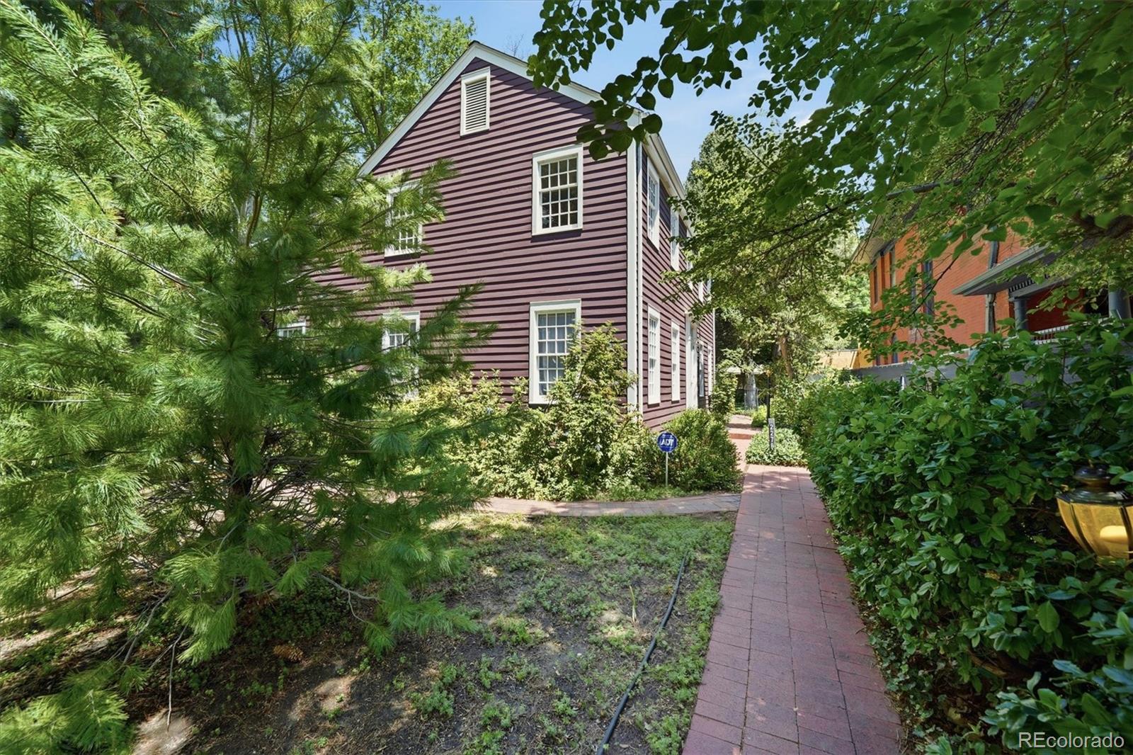 Located just across the street from Observatory Park, this traditional two-story New England Saltbox offers timeless design in one of Denver’s most desirable neighborhoods. This home was built in 1963 by the current owners to replicate the love they had found for New England architecture while pursuing their studies in Boston. They were lucky to find this lot and an architect, Dick Gilbert, to help them create their vision. The freshly painted interior, true divided light windows, and oak floors create a move-in ready atmosphere with the fantastic opportunity to update. The main level is designed for everyday living and entertaining. There is a lovely living room with gas fireplace overlooking the park with an adjoining formal dining room. The dedicated study on this level with built in bookcases and closet could double as a guest room. Laundry space and a separate 3/4 bath are conveniently located on this level as well. The efficient kitchen has an electric cooktop, wall oven, and side by side refrigerator. The adjoining informal dining space offers generous extra storage. Just off the kitchen, and providing access to the backyard, is a spacious family room that was added in 1969. Adorned with Pine “Georgian board” tongue and groove paneling, large closets and tile floor this space serves as a comfortable family room. A large slider opens to an impeccably landscaped yard perfect for summer entertaining. The side load, two car garage sits on the alley. Back inside, the upper level has a large primary suite with adjoining bath overlooking the park and three additional bedrooms plus a hall bath. This well maintained home has a newer (2017) gas boiler, beefed up insulation and roof all of which should make it comfortable and carefree to years to come. This fantastic neighborhood is close to DU and boasts the Chamberlin Observatory just across the street! There is a park and playground too! Excellent elementary school, I-25 and numerous restaurants and shops nearby.