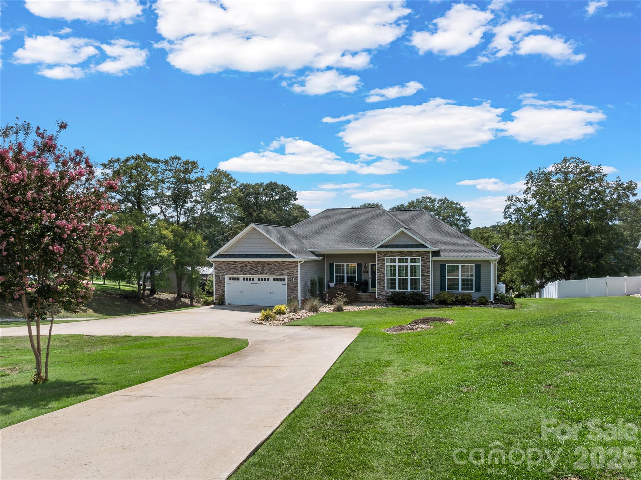 Lake days and nights start right outside your back door! Set along the shoreline of beautiful Lake Blalock, this exceptional property pairs incredible water views with approximately 1.2 acres, 135 feet of lakefront and generous outdoor living spaces.The spacious primary suite offers a private full ensuite, beautiful lake views right from the bedroom, and direct access to the back deck—imagine waking up to the peaceful water views and stepping outside to begin your day overlooking Lake Blalock.Outdoor living is a highlight of this property, with a screened-in back porch and expansive deck providing the perfect lake days and nights start right outside your back door! Set along the shoreline of beautiful Lake Blalock, this exceptional property pairs incredible water views with approximately 1.2 acres, 135 feet of lakefront and generous outdoor living spaces.This gorgeous 3-bedroom, 2.5-bath home features a desirable split-bedroom floor plan, a warm and inviting fireplace, formal dining room, and a designated office/study—perfect for working from home or creating a quiet retreat. The functional, well-designed kitchen features beautiful cabinetry, ample storage and workspace, making it equally suited for everyday meals or preparing dinner for family and friends.A sizeable private dock and boat slip provide direct access to the water and yet another place to relax, fish, launch your lake adventures, or simply enjoy the serenity of Lake Blalock.In addition to the full two-car attached garage, below the home you'll find a large workshop and storage area with room for an additional vehicle, lawn equipment, tools, recreational gear, and much more. The approximately 1.2-acre lot also provides ample space for RV or camper parking.From evenings by the fireplace to summer days on the water and sunsets enjoyed from the screened porch, deck, or dock, this property offers space to live, entertain, work, play, and unwind—all from the comfort of home. Come discover why life really is better at the lake! Did we mention... NO HOA.