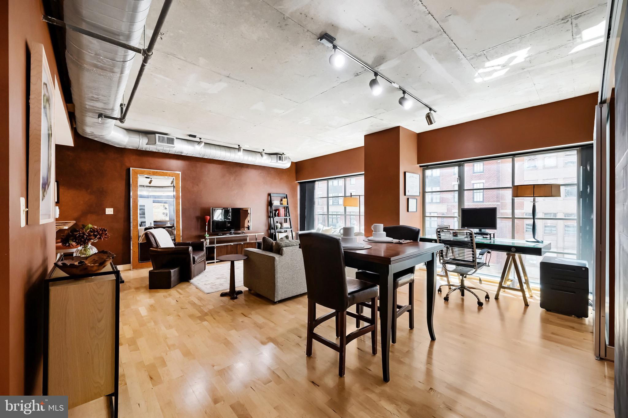Welcome to Eight50 Aliceanna, a sophisticated one bedroom, one bath condominium in the heart of Harbor East offering over 1,000 square feet of well designed living space. This NY-style loft features high ceilings, hardwood floors throughout, and expansive walls of windows that bring in abundant natural light and showcase attractive city views. The open concept living and dining area connects seamlessly to the kitchen, which is equipped with stainless steel appliances, granite countertops, and a breakfast bar, making it ideal for both everyday living and entertaining. The spacious primary bedroom includes two closets, while the well appointed bathroom features a walk in shower with clean, contemporary finishes. A highly desirable parking space located on the same floor as the residence adds exceptional convenience. This boutique condominium is ideally situated just steps from Harbor East’s restaurants, boutique shopping, Whole Foods, Starbucks, the waterfront, the Inner Harbor, and vibrant city amenities. The condo fee includes air conditioning, heat, water, and trash offering a low maintenance lifestyle in one of Baltimore’s most sought after neighborhoods.
