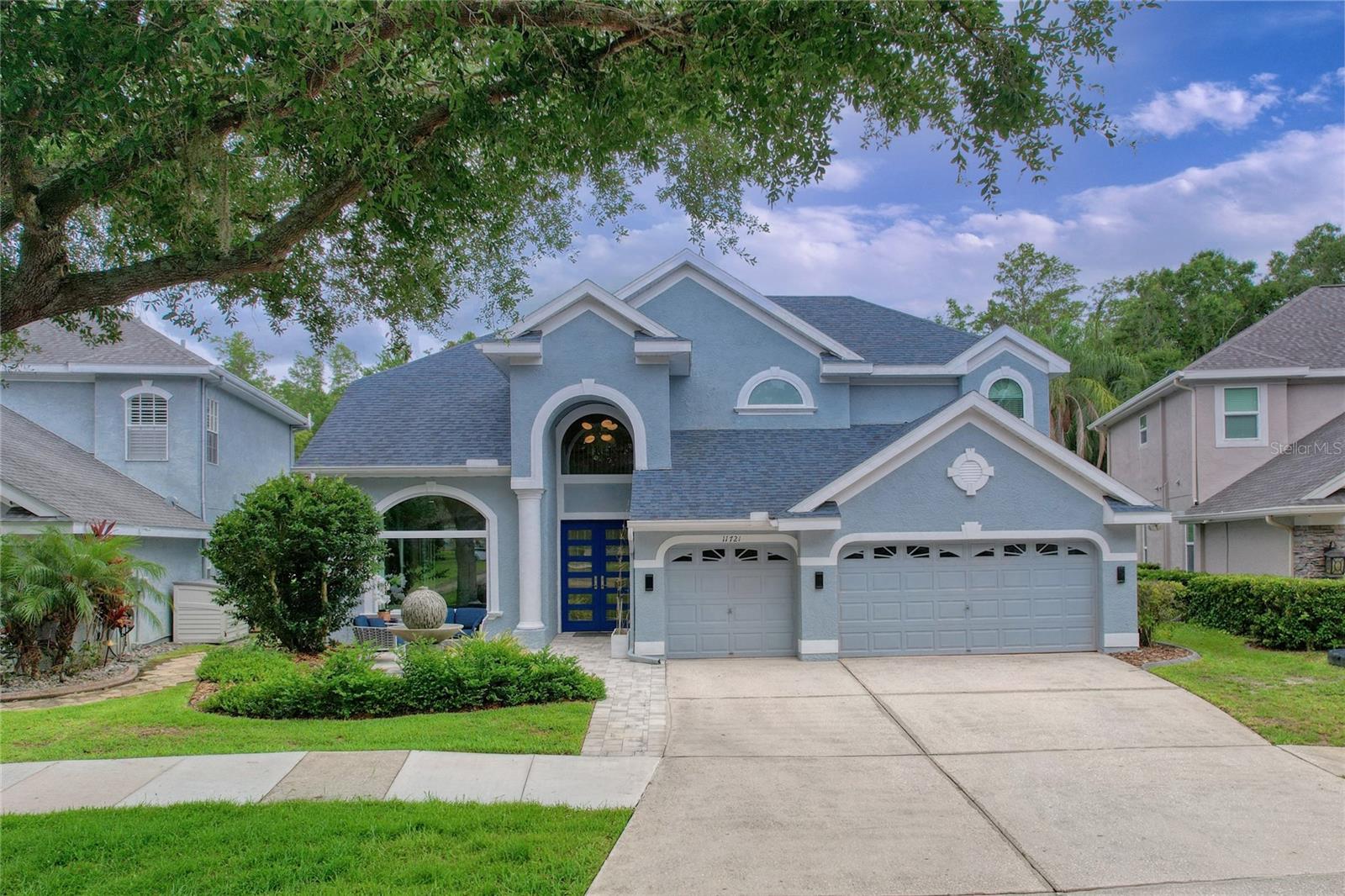One or more photo(s) has been virtually staged. Mandolin Estates!!! Welcome to 11721 Gothic Lane, a stunning executive pool home tucked behind the gates in one of Northwest Hillsborough County’s most desirable communities near Westchase. Perfectly positioned on a premium lot with tranquil pond views in the front and no rear neighbors overlooking peaceful conservation, this beautifully refreshed residence offers a rare combination of privacy, architectural character, and elevated Florida living.From the moment you enter, soaring ceilings and abundant natural light create an impressive sense of scale and openness. Architectural details throughout the home add warmth and sophistication, including a coffered ceiling in the formal dining space and a dramatic vaulted ceiling in the family room.Thoughtfully designed with flexibility in mind, this expansive residence offers 4 bedrooms, 3.5 bathrooms, an oversized upstairs loft, and a 3-car garage with a floor plan ideal for everyday living and entertaining. The first floor features a spacious primary suite along with a versatile downstairs bedroom with a closet that can also function as the ideal work-from-home office. The first floor additionally offers two full bathrooms plus a convenient half bath with direct pool access. Upstairs, you’ll find two additional bedrooms accompanied by a generous loft perfect for a media room, playroom, fitness space, or second living area.This home underwent an extensive refresh in 2026, giving buyers the rare opportunity to purchase a truly move-in-ready property. The entire interior was professionally repainted, BRAND-NEW luxury vinyl plank flooring was installed throughout the first-floor living areas, and NEW carpeting was added to the primary suite, staircase, and second floor. The kitchen was beautifully updated with professionally refinished and repainted solid wood cabinetry, creating a bright, elevated feel throughout the heart of the home.Designed to bring everyone together, the open-concept kitchen overlooks the main living spaces and pool area and features granite countertops, stainless steel appliances, abundant cabinetry, and generous prep space.One of the home’s standout features is the seamless indoor-outdoor living experience. Triple sliding glass doors open the family room to the expansive covered and screened lanai, creating a true extension of the living space. The private screened pool overlooks tranquil conservation views and mature landscaping, delivering the type of backyard setting buyers rarely find at this price point.Additional major improvements include a NEW ROOF (2019), downstairs HVAC replacement (2022), pool equipment replacement (2023), and water softener installation (2023).Located within the gated community of Mandolin Estates, residents enjoy convenient access to the Westchase area, Veterans Expressway, Tampa International Airport, International Plaza, Citrus Park Mall, top-rated dining and shopping, and the Gulf beaches. Zoned for highly rated schools including Deer Park Elementary, Farnell Middle, and Alonso High School.Homes offering this combination of a premium lot, conservation views, soaring ceilings, architectural detail, flexible layout, extensive updating, and gated convenience rarely become available in Mandolin Estates.