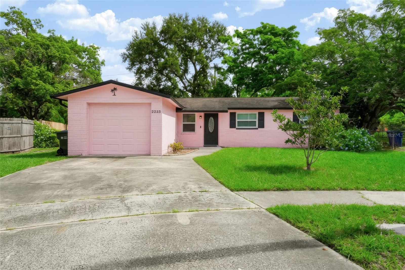 Welcome to 2223 Fulton Way, a 3-bedroom, 2-bath block home that's been updated throughout and sits on nearly a quarter acre at the end of a tucked-away Largo cul-de-sac, with no HOA and no flood zone. Impact-rated windows and sliding glass doors are already in place, along with new rain gutters, fresh interior paint, recessed lighting, and new fans and fixtures. Move-in ready from the moment you step inside, this home is a true turnkey find.An open floor plan and plenty of windows keep the home bright and airy. The kitchen offers stone countertops, a gas range, and abundant cabinet space, ready for everyday cooking and weekend entertaining. New flooring runs through the bedrooms, and the primary suite includes its own en suite bath, with a new vanity and fixtures. Pull right into the one-car garage for added convenience, with extra storage space and the washer and dryer right there.Backyard living is a real highlight here. A large, fenced lot with no rear neighbors gives you the kind of privacy and open green space that's hard to find, with plenty of room to entertain, garden, play, or relax in a tranquil, park-like setting.Sugar-sand Gulf beaches are just minutes away, with the Southwest Recreation Center, Publix, area hospitals, shopping, and dining all close by.  Updated, private, and move-in ready, 2223 Fulton Way delivers the lifestyle you've been waiting for. Schedule your private showing today and don’t miss out!