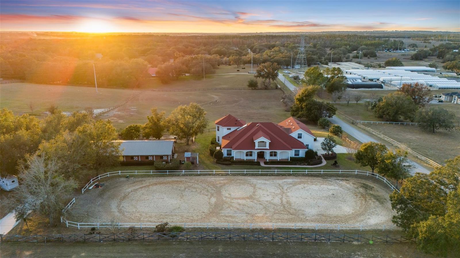 **A RARE OPPORTUNITY YOU WON’T WANT TO MISS!!** 9.75 PRIME ACRES IN THE HEART OF WINTER GARDEN ~ MAIN HOME CUSTOM BUILT BY HANNIGAN HOMES 5BD/4BA/3-CAR- 5,423 SQFT, INCLUDING AN ABOVE GARAGE APARTMENT WITH 1/BD/1/BA/+KITCHENETTE ~ SECOND HOME ON PROPERTY INCLUDES 4BD/2BA/2-CAR - 2,082SQFT ~ 10-STALL + TACKROOM HORSE BARN - 2,592 SQFT, 3 PASTURES ~ FENCED IN RIDING RING AND MUCH MORE!  This countryside estate is an exclusive opportunity to own two homes, a horse barn, an adorable chicken coop, Koi pond, paver fire pit, built-in playground and so much more in the heart of the sought-after Winter Garden! Bring your horses and enjoy all that this massive CORNER LOT has to offer and being just minutes from the 429 gives you easy access to every convenience including neighboring HORIZON WEST and DISNEY THEME PARKS. Being sold all as one gives you endless opportunities in the ADDITIONAL SINGLE FAMILY HOME with the main home ready with charm for a family to make it their own. The long covered front porch welcomes you home and gives you front row seats to the riding ring. Built by Hannigan Homes, the main home was modeled after Disney’s Grand Floridian, and the thoughtful and unique features throughout are the perfect blend of comfort and quiet luxury. The roof was updated in 2019, the office space can serve as an additional bedroom, light and bright with views of the property, there is a movie/media room currently being used as an indoor trampoline park, WALK-IN WINE CELLAR for the adults, a fun HIDDEN WALK-IN PANTRY for ample kitchen storage and an energy saving SOLAR WATER HEATER. The new owner will absolutely fall in love with the PRIVATE PRIMARY SUITE that takes up the entirety of the second floor with sweeping views overlooking your estate, large WALK-IN CLOSET and well appointed ensuite bath. The additional bedrooms on the main floor give room to grow,  and the additional home and garage apartment graciously allow for multi-general living. This gorgeous property is best experienced in person (stunning sunsets included!) so it can speak for itself - call today to schedule your private tour today!