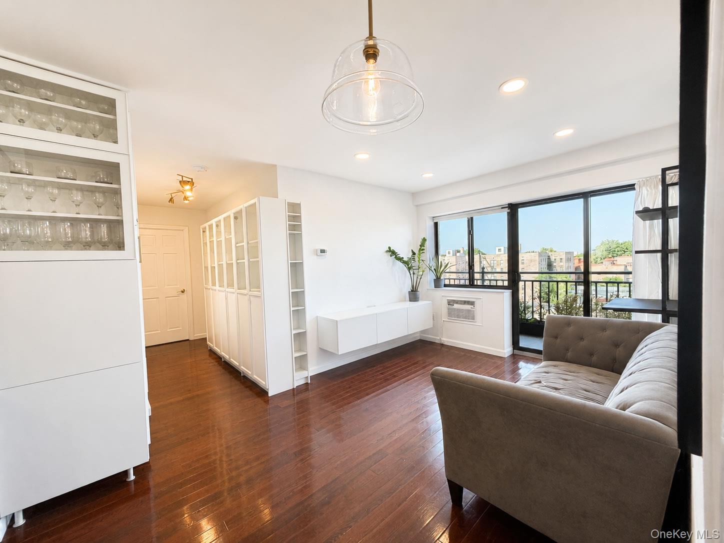 Welcome to this beautifully upgraded high-floor 2-bedroom, 2-bath condo featuring panoramic skyline views, a private balcony, in-unit laundry, abundant storage,  stainless steel kitchen appliances, solid wood cabinetry, hardwood floors, and modern smart-home upgrades. Just a three-minute walk to the 7 train and steps from shopping, dining, bakeries, parks, and everyday conveniences, this move-in-ready home offers exceptional comfort, value, and accessibility in the heart of Jackson Heights. A valuable tax abatement adds to its appeal, with the option to purchase an indoor parking space within the building.Property Highlights:High-floor 2-bedroom, 2-bath condo with panoramic skyline viewsStainless steel kitchen appliances, including a refrigerator, dishwasher, and gas stoveSolid wood cabinetry and hardwood flooring throughoutOnly a three-minute walk to the 7 trainBus service conveniently located directly outside the buildingOversized private balcony ideal for relaxing, entertaining, and enjoying sunrisesBright, open layout with abundant natural lightGenerous storage throughout the home, walk-in closetWasher and dryer inside the unit, plus an additional laundry service downstairsWi-Fi-enabled smart light switches throughout and keyless fingerprint entryRecessed lighting throughout, updated hardware, and modern finishesValuable 421-a tax abatement Low monthly common charges, helping keep ownership costs affordable Modern elevator condominium built in 2017Controlled building access and security cameras throughout the propertyWelcoming building and neighborhoodSteps from restaurants, bakeries, supermarkets, specialty markets, and shopping2-5 minute walk to the Library, Target, Banana Republic, Foot Locker, Shake Shack, Starbucks, McDonald’s, and moreClose to parks, recreational spaces, and the Garden SchoolClose to the 34th Avenue Open Street for walking, biking, jogging, fitness,  activities, and weekend farm marketsOptional indoor parking space available for separate purchaseSecure, two-level indoor parking garage located within the building