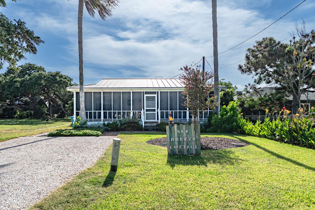 Welcome to your prefect beach retreat on the beautiful Texas Coast! Nestled in a serene and friendly neighborhood known by locals as Old Rockport, this delightful 2-bedroom 1-bathroom cottage offers the ideal blend of charm, comfort, and outdoor living.  Step inside to find a bright, open-concept kitchen and dining area designed for gatherings with family and friends. The kitchen flows seamlessly into the dining space, creating a welcoming environment for meals, games, or casual conversation. You'll love the coastal character, with classic shutters and tasteful finishes throughout. Both bedrooms are spacious and thoughtful and the home offers plenty of storage. Outside, the tropical landscaped gardens provide a peaceful oasis. Enjoy cookouts on the girl, unwind under the stars, or simply relax with a good book in your expansive outdoor living area. The property includes a sprinkler system to keep your lawn and garden lush, and a sturdy shed perfect for all your beach gear, garden tools or seasonal decor! Whether you're looking for a weekend getaway, an investment property, or a full-time coastal lifestyle, this charming home delivers on comfort, community, and the laid-back beach-town vibe you've been dreaming about for years! Home is being sold fully-furnished with all appliances! Don't miss your chance to own a slice of paradise on the Texas Coast! Call your favorite Realtor today and schedule a showing!