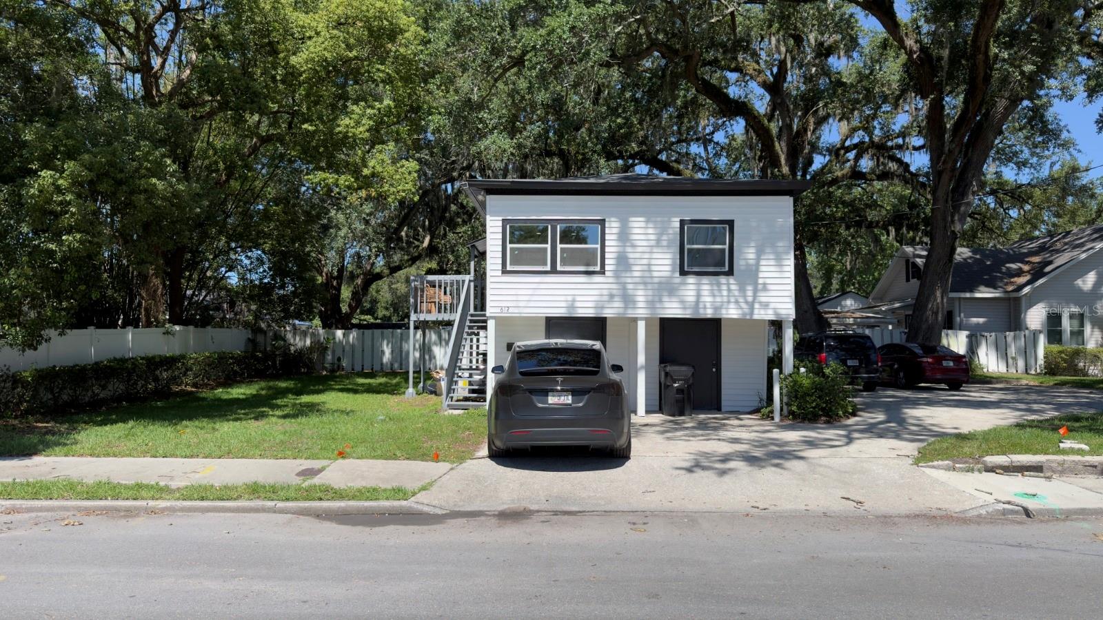 Virtually Staged. Prime Residential and Commercial Investment Opportunity in Colonialtown/Downtown Orlando! This well-located property at the corner of Hampton and Hillcrest offers a fantastic opportunity for both residential and commercial use. The detached 546 sq ft unit has been fully renovated and is configured as a 2-bedroom, 1-bathroom residential unit, creating excellent potential for rental income or a guest suite. Below this unit, there are two storage spaces planned to be converted into apartments, currently in the permitting process, with plans available.The main building offers 1,016 sq ft of heated and cooled office space, featuring 2 private offices and a main open area. This commercial space is ideal for professional offices, consulting businesses, or small companies seeking a central Downtown Orlando location.The property sits on a large corner lot with 6 parking spaces and an improved parking area. The exterior features mature oak trees, lush landscaping, St. Augustine grass, and a full sprinkler system. The main office building has a roof installed in 2012, while the residential unit has a roof installed in 2020, and HVAC systems were updated in 2022 and 2023.Located just one block from Colonial Drive, this property offers convenient access to downtown Orlando, the courthouse, shops, restaurants, and public transportation. With new developments planned across the street, this property presents a strong opportunity for both residential and commercial use in a prime location.