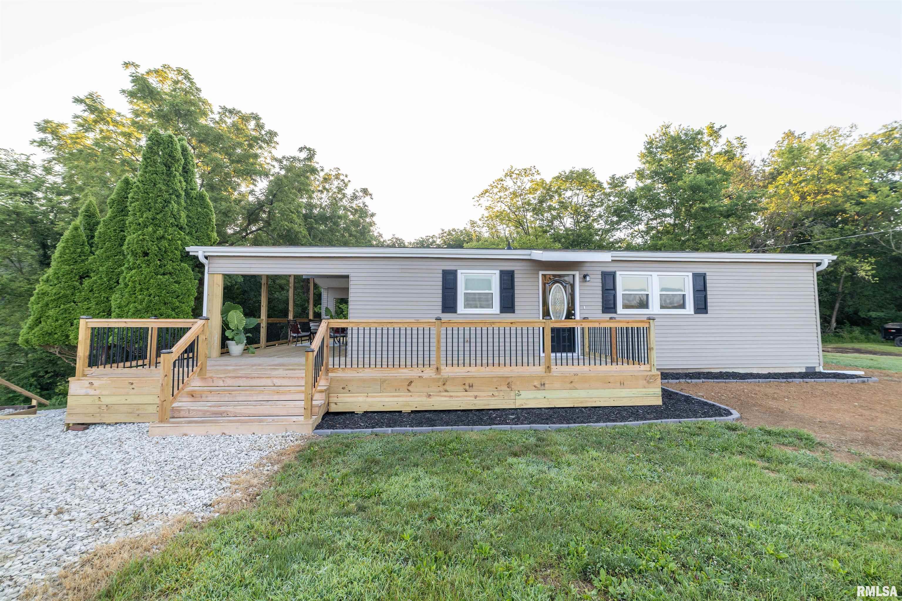 Completely Remodeled Modern Ranch on the Edge of Town! This beautifully updated home offers the perfect blend of peaceful country-style living with the convenience of town just minutes away. Every inch has been thoughtfully remodeled, creating a stunning move-in-ready home with today's most sought-after finishes and an inviting open-concept floor plan. The spacious living, dining, and kitchen areas flow seamlessly together, making this home ideal for entertaining or everyday living. Modern finishes, abundant natural light, and a clean, contemporary design create a warm and welcoming atmosphere throughout. Relax on the new wrap around deck that is partially covered for the warm summer evenings, take in the peaceful surroundings, and enjoy the perfect balance of comfort, style, and convenience.  Roof - July 2022 Water Heater - Oct 2025 Furnace - Feb 2026 Septic System - 2026 Hook up to Mill Creek Water - March 2026  If you've been searching for a home with modern updates, an open layout, and a desirable edge-of-town location, this one is ready to impress! Schedule your private showing today. **Broker Owned** *Taxes to be determined due to recent parcel split*