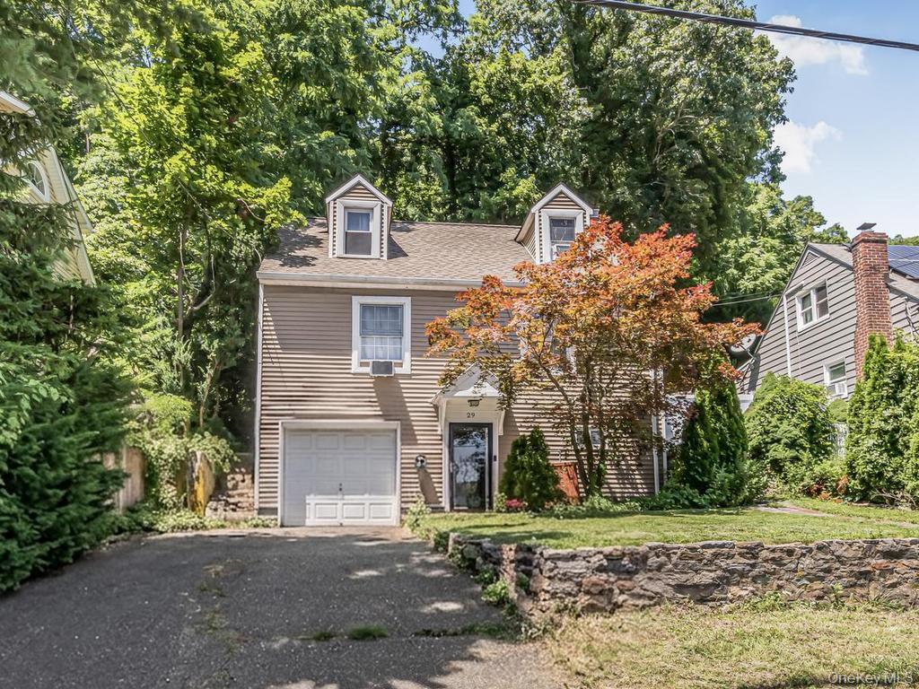 Enjoy the comfort and privacy of a single-family home with the easy, low maintenance feel of a townhouse. This charming three-bedroom, two-bath residence offers a smart multi-level layout that provides separate living spaces while remaining warm and inviting.The home features an eat-in kitchen, hardwood floors, central air conditioning, natural gas heat, a family room or home office on the lower level, an attached one-car garage, and a private outdoor patio/deck. Its townhouse-style design makes it an excellent alternative to a condominium or co-op, with no shared walls or monthly HOA fees.Location is one of this home’s greatest advantages. It’s less than a mile from the Hartsdale Metro-North station, making commuting to Manhattan quick and convenient. The property also offers immediate access to the Bronx River Parkway, Interstate 287, the Sprain Brook Parkway, and Central Avenue, placing shopping, dining, parks, and everyday conveniences just minutes away.Whether you’re looking for your first home, downsizing from a larger property, or seeking an affordable Westchester home with an easy commute, 29 S. Washington Avenue combines convenience, functionality, and the benefits of single-family ownership in a highly desirable Hartsdale location.