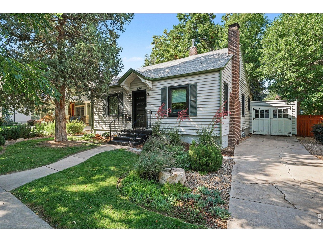 Mountain Avenue. Under $700K. Read that again.Five blocks from Old Town Square, this 1940 bungalow sits on one of Fort Collins' most iconic streets - walk to breweries, farmers markets, the Poudre Trail, City Park and every restaurant downtown. And it's already done: original hardwood refinished, updated kitchen with new appliances, remodeled bath, all-new Renewal by Andersen windows and front door, central A/C, plus a full rewire and replumb.Outside, the lot steals the show. A private, mature-tree-shaded backyard with fresh landscaping, full sprinkler and drip irrigation, new fencing and off-street parking. Partial basement adds storage and laundry. Buy the address, keep the charm, add on later.