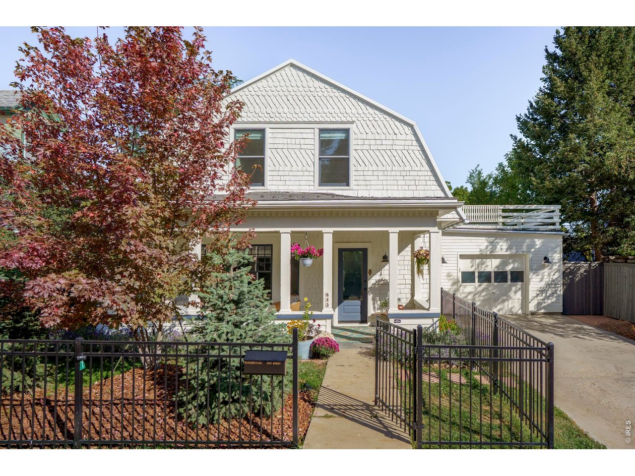 A jewel box of a home in Boulder's historic Mapleton Hill, 653 Dewey makes a carefree and connected Boulder lifestyle dream your reality. Equally walkable to North Boulder Park, the amenities of Ideal Market, downtown Pearl Street and the Mount Sanitas trail system, this super-stylish and fully updated historic home offers the best of Boulder in every direction. Artfully renovated by one of Boulder's most reputable historic-home contractors, this three-bedroom, two-bath home reflects exceptional care for both the aesthetic and mechanical details. Oversized windows fill the rooms with natural light, highlighting refinished hardwood floors, exposed brick, original dining-room built-ins and a wood-burning fireplace. The bright, open kitchen offers generous cabinetry and pantry storage, while custom bathrooms and updated plumbing bring modern comfort to the home's timeless appeal. A covered front porch lets you soak in the neighborhood vibe while a spacious second-story deck captures sweeping foothill views, ideal for entertaining. A lush, fenced backyard offers room for summer barbecues, a dog and a vegetable garden, with potential for an ADU. Bedroom built-ins, an attached single-car garage and a sunny, spacious, upstairs laundry room make everyday living easy. The current owner has upgraded the property with top-of-the-line custom cedar and iron fencing, a premium DaVinci shake roof, a new furnace and numerous additional improvements detailed in the MLS attachments. This home has been part of many of Boulder's chapters. Now it's time to write your own.