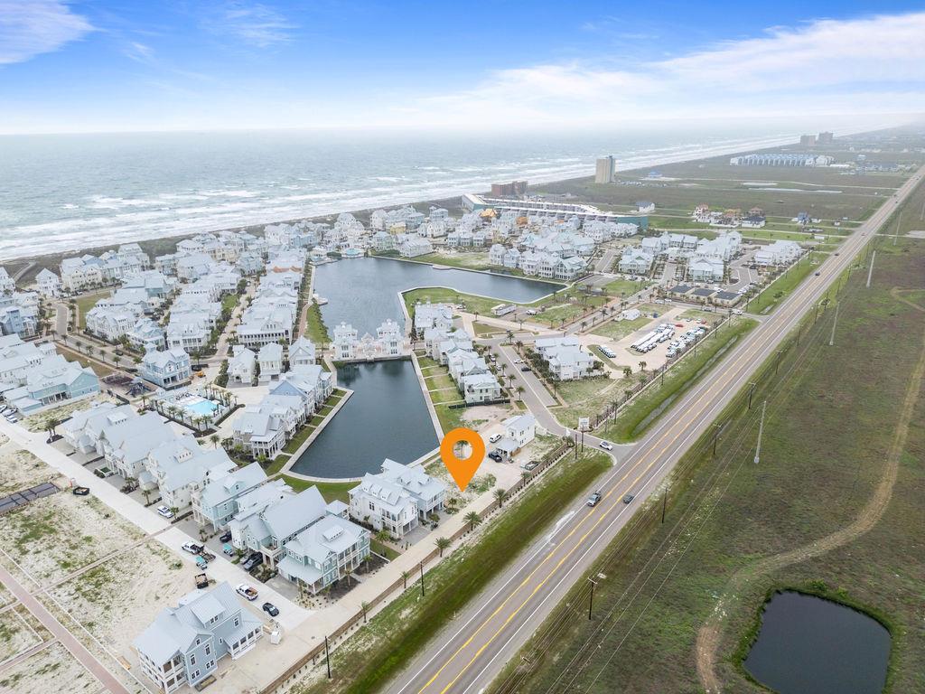 Design your ideal coastal retreat on this expansive homesite overlooking tranquil Sundown Lake in the coveted Cinnamon Shore South community. Imagine mornings with coffee on your lakeside terrace and evenings taking in vibrant sunset reflections over the water. Perfectly positioned to embrace outdoor living, your future home here will offer seamless access to community features. Walk to the nearby Seascape Courts for pickleball or basketball with friends, or cool off in one of the four established resort pools. Beach days are effortless with dune crossovers for quick golf-cart rides to the Gulf's sugar-sand shores. Looking ahead, the planned South Town Square will provide a lively gathering place with open-air seating, boardwalk paths, green space, and a lakefront stage for events. Cinnamon Shore South is designed for those who value connection, relaxation, and elevated coastal living. Don't miss your chance to secure this premium site and bring your vision of the perfect beach home to life.