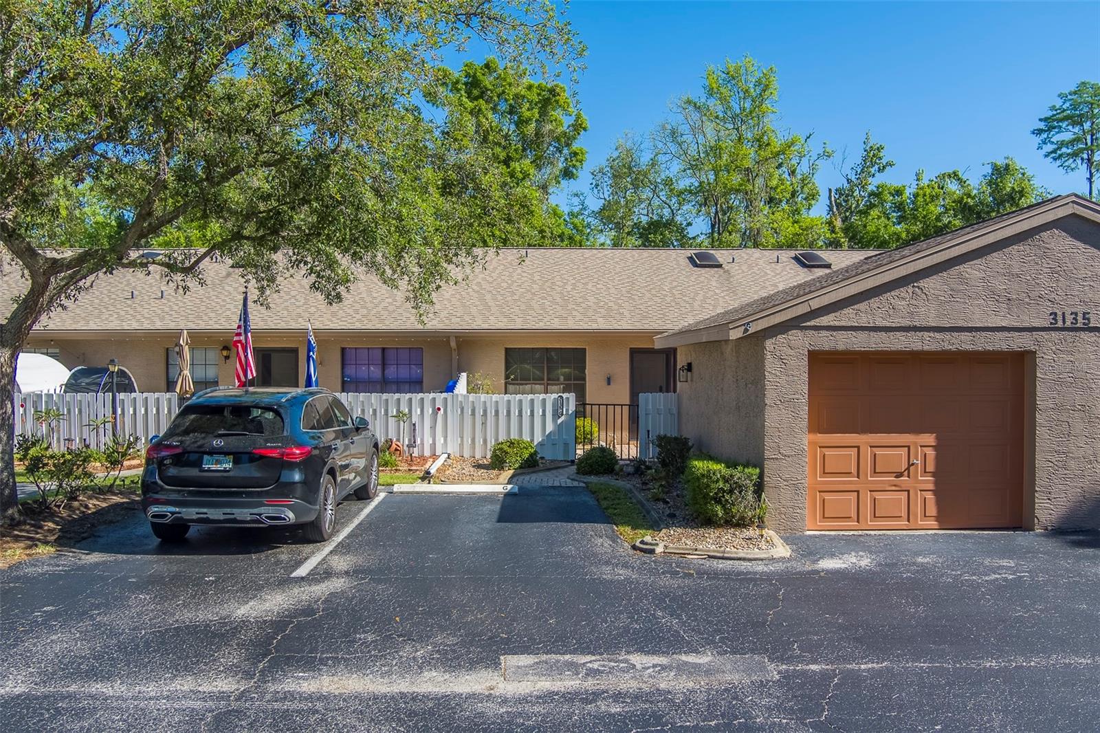 Welcome to your perfect Florida retreat in the highly sought-after Pine Village community of Tarpon Springs! This charming 2-bedroom, 2-bath villa is move-in ready and ideally located in a top-rated school district. Enjoy low-maintenance living with an HOA fee that covers nearly everything except electric, providing exceptional convenience and value.Inside, you’ll find brand-new vinyl flooring throughout the main living areas, moderately updated bathrooms featuring newer vanities and fixtures, and a desirable split-bedroom floor plan offering added privacy. Relax in the private front courtyard or unwind on the back patio, conveniently located just off the spacious enclosed Florida room, perfect for year-round enjoyment.The home also features a large one-car garage plus an additional reserved parking space. As a resident of Pine Village, you’ll enjoy access to the private community pool and beautifully maintained, peaceful surroundings.Don’t miss this opportunity to own a lovely villa in one of Tarpon Springs’ most desirable communities. Schedule your private showing today, you won’t be disappointed!