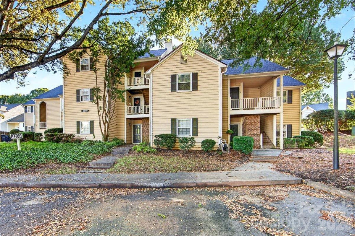 Welcome to this updated top floor condo in Sedgefield, offering two bedrooms and 1.5 baths. Bright and spacious living spaces with vaulted ceilings, fresh paint, and new flooring in the living areas. The newly renovated kitchen and baths feature quartz counters and painted white cabinetry. The private balcony with storage closet offers the perfect spot to unwind and entertain. Ample parking makes coming and going easy. Enjoy the community pool and the convenient location; a quick stroll to South End dining, coffee, and shops as well as all that Dilworth has to offer. Comfortable, convenient, and move in ready, this condo offers the best in a lock and leave lifestyle.