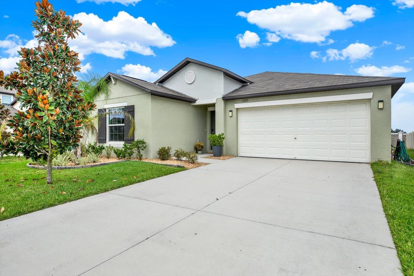 Modern Living in Mirada's Lagoon Community! Welcome home to this stylish 4-bedroom, 2-bath single-family residence, where contemporary finishes meet easy, open living. Sunlight pours through the home, brightening every spacious room. The thoughtful split floor plan puts the owner's suite at the back of the house for added privacy, while the three additional bedrooms sit together at the front. Each bedroom features plush carpeting and a ceiling fan for year-round comfort. The kitchen is a showpiece, with granite countertops, stainless-steel appliances, and a clean, modern palette that fits any décor. Practical touches abound, including a roomy garage and a separate laundry room that comes with a washer, dryer, and built-in cabinetry. Beyond your front door is Mirada, a master-planned community centered on a stunning 15-acre lagoon. Residents enjoy dog parks, playgrounds, and miles of walking trails, all with a resort-style, beach-without-the-drive feel. Commuters will love the location, just minutes from I-75, with Tampa and Sarasota both within easy reach.