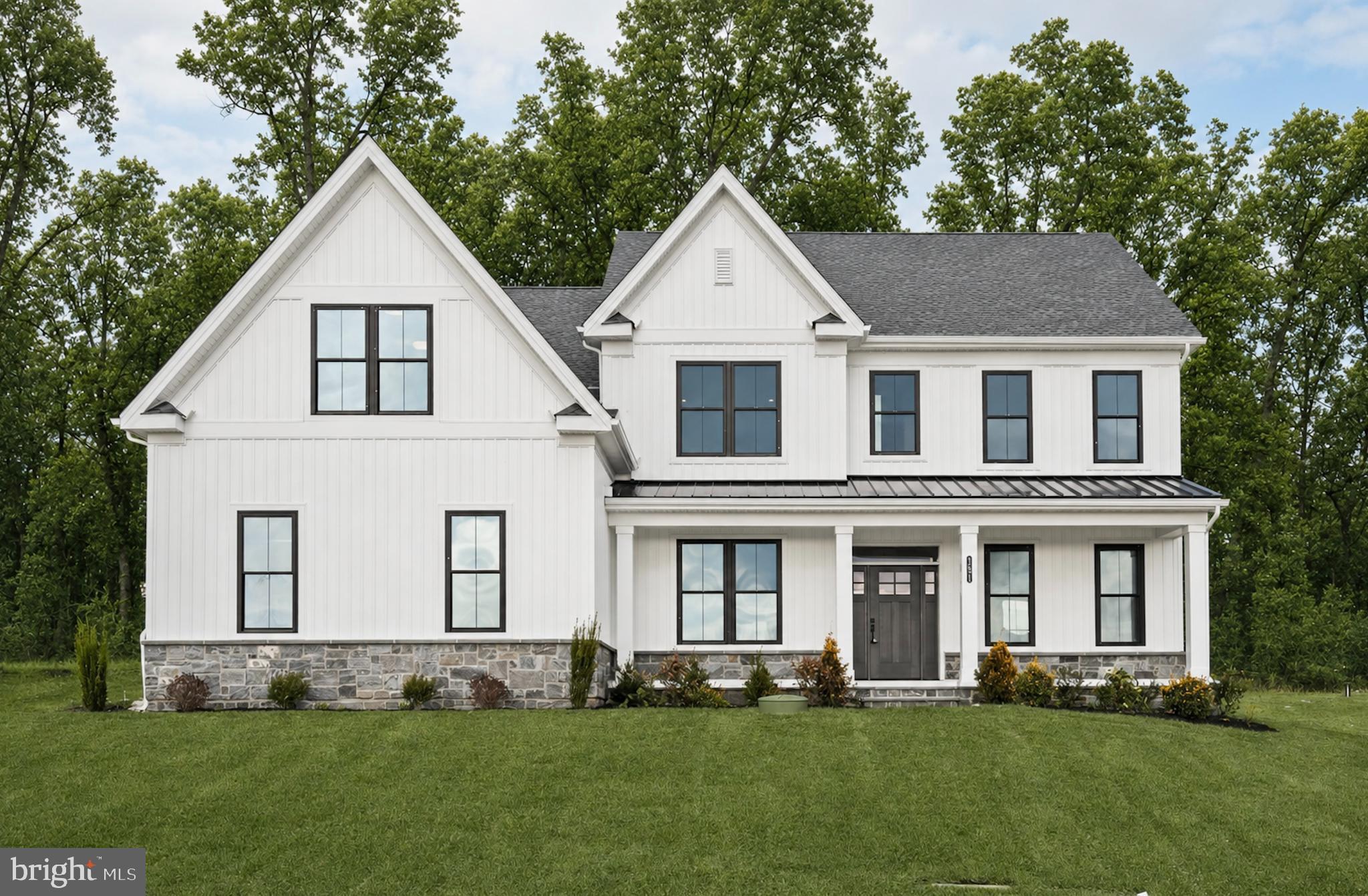 A Designer Home You Couldn’t Build Today for This Price. This new construction semi-custom built by home by Foxlane Homes offers over 4,800 square feet of elevated living on a private low maintenance wooded homesite in the Downingtown School District. A Georgetown floorplan designed with 4 bedrooms, 3 full and 2 half baths, and a 3-car side-entry garage. A grand foyer opens to a flexible study and an elegant dining space. The chef’s kitchen is beautifully appointed with premium KitchenAid appliances, upgraded cabinetry and countertops, flowing seamlessly into a sunlit great room with a gas fireplace and a serene sunroom beyond. Outdoor living space shines with a bluestone front porch and composite rear deck. Upstairs, the owner’s suite is a true retreat with cathedral ceilings, closet designed to accommodate even the most curated wardrobe, and a spa-inspired bathroom featuring a free standing soaking tub to retreat to after a long day. A finished lower level adds versatile space for entertaining, fitness, or relaxation finished off with a powder rm. This new construction move in ready home is located within The Estates at Stonecliff, an intimate enclave of 36  1/2 acre estate homes surrounded by Chester County’s rolling hills and expansive areas of open space.  Enjoy the peaceful surroundings of the Chester County countryside in a new home with close proximity to the many amenities of Downingtown, Chester Springs and Exton, and easy access to Route 100 and the Pennsylvania Turnpike. This is refined luxury you dream of...available now, but not for long.
