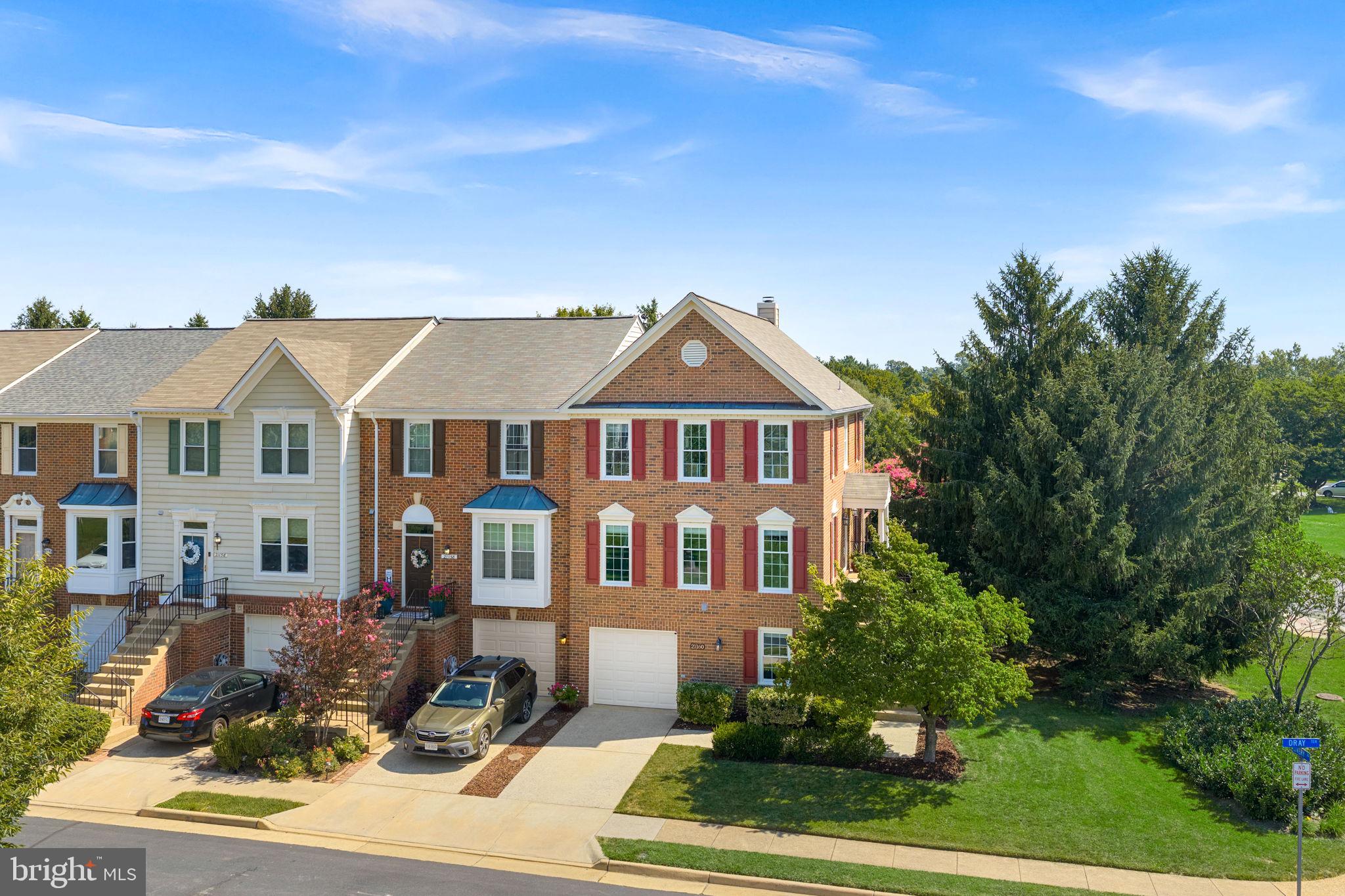 Welcome to 21160 Dray Terrace, a beautifully updated end-unit townhome in highly sought-after Ashburn Farm. With 3 bedrooms, 3 full baths, abundant natural light, and fantastic outdoor spaces, this home offers plenty of room to spread out both inside and out.The main level welcomes you with beautiful hardwood floors and tons of natural light throughout. The updated kitchen features white cabinetry, granite countertops, stainless steel appliances and easy access to the deck, perfect for morning coffee, grilling, or relaxing at the end of the day.Upstairs, the spacious primary suite features a large walk-in closet and a gorgeous updated en-suite bath. Two additional bedrooms and an updated full hall bath complete the upper level.The walk-out lower level adds even more living space with a large rec room, additional full bath, and conveniently located laundry/mudroom. Step outside to a lower deck and beautifully landscaped backyard that feels like your own private oasis.Major updates include a new roof and windows in 2015, garage door in 2018, HVAC in 2020, and water heater in 2023.Located in the heart of Ashburn Farm, residents enjoy an incredible list of community amenities including three pools, sports fields and courts, miles of walking and biking trails, tot lots, ponds, and more, all in a convenient Ashburn location close to shopping, dining, schools, and commuter routes.
