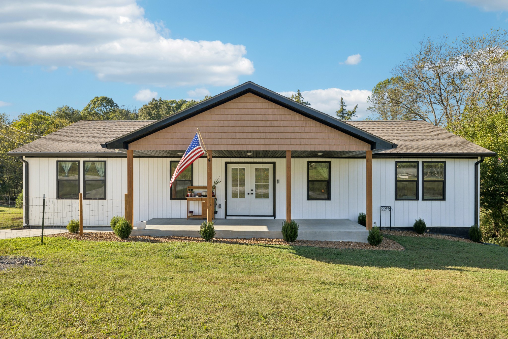 Perfect setup for multi-generational living with one level on the main and a fully finished basement! This 4 BR / 3 BA home offers a spacious main level with an open-concept floor plan, vaulted ceilings, and 3 bedrooms/2 baths on main floor. The kitchen boasts white cabinetry, built-in pantry cabinets, granite countertops, stainless appliances, and a large island. The finished basement with upgraded insulated ceilings is currently used as a mother-in-law suite, complete with a full kitchen, living room, utility area, and a spacious bedroom with a full bath. Covered front porch with fenced front yard, spacious back deck, gutter guards.  Current owner invested $28,000 in additional builder upgrades beyond the original MLS sold price. Conveniently located within walking distance to the lake and less than 1 mile to K-8 school.(island in basement will not remain).  Basement washer & dryer will remain. Video & audio recording will be present in home during all showings.
