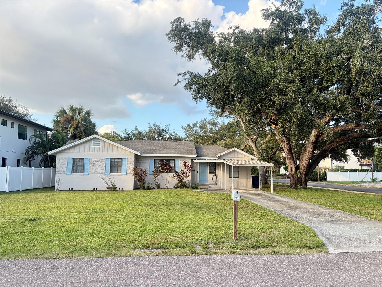 Possibility awaits on this CORNER LOT with LARGE BACKYARD in South Tampa Swann Estates. This 4/2 home features wood floors throughout main house, with wood style laminate in master and breezeway and 1 car carport. Located in Grady Elementary, Coleman Middle, and Plant High school district. Conveniently located to Midtown, Westshore, International Plaza and an easy commute to Macdill Airforce Base.