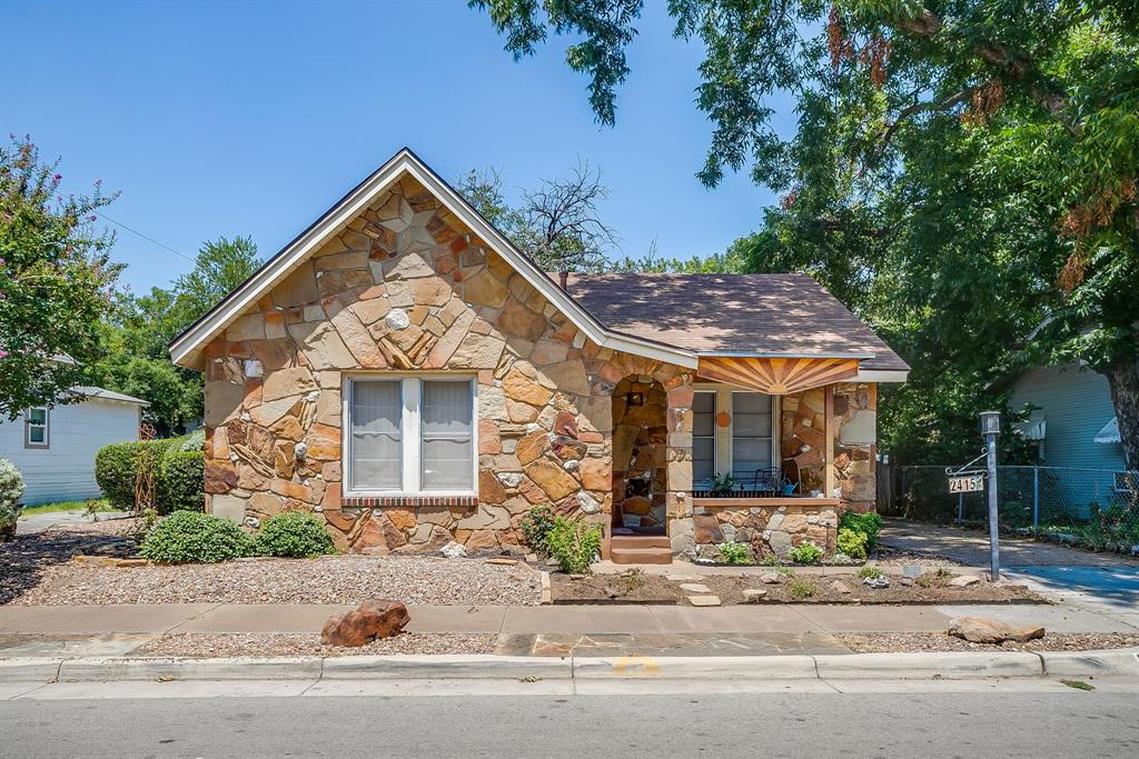 NOW PRICED BELOW MARKET VALUE! Welcome to a little piece of history in one of the most up and coming parts of the city of Fort Worth! This charming 2 bedroom, 1 bath home has so many original and unique features, including stained glass windows repurposed from a local church and stones from the previous owner's personal collection, intricately placed within the stone facade. Other features include low maintenance landscaping with drip system, beautiful outdoor living space, backyard dining area, 2 detached storage buildings, plumbed, and wired for electrical and could be converted to an additional dwelling unit, and a 2 car garage. There is also a large storm shelter with electricity in case you need a place to ride out our unpredictable weather! All just steps away from the Trinity River Trails and just minutes to Downtown! This home has been lovingly maintained by the same owner for the last 49 years. Some furnishings are also for sale.