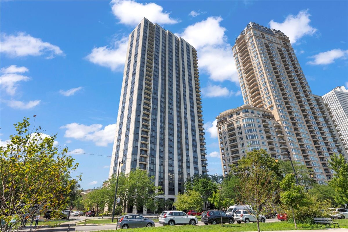 Discover this highly coveted and rarely available 04-tier unit at 2500 North Lakeview Avenue. Unit 3404 was completely renovated in 2017 with premium finishes and high-end appliances throughout. It is a 3-bedroom, 2- bath corner unit with breathtaking east-facing views with a covered balcony overlooking Lake Michigan, Diversey Harbor, and Lincoln Park's North Pond. From the balcony to the north enjoy views of the Diversey Driving Range, and to the south, take in the dazzling city skyline. Situated on the thirty-fourth floor of a premier full amenity building, this thoughtfully designed unit boasts Brazilian Walnut hardwood floors, generous closet space, and a welcoming formal foyer. The gourmet kitchen features custom cabinetry and stunning quartz countertops with chef-quality stainless steel appliances, including an induction cooktop with matching vent hood, and thoughtfully designed vertical spice racks for the ultimate culinary convenience.   The primary suite serves as a private sanctuary with premium wall speakers, a custom large closet with built-in drawers, and a spa-inspired bathroom. The bathroom features custom cabinetry, quartz countertops, and luxury shower system featuring thermostatic valves with dual individual pressure controls for both fixed and handheld options. Bedrooms two and three are generously sized and offer beautiful north and west exposures. The second full bath provides guests with their own spa-like experience with a full shower. This unit features a front-loading washer & condensation dryer.  This is a prestigious 35-story building right on the lakefront and is meticulously maintained by a 24/7 door staff and on-site professional management team. Amenities include a heated outdoor pool, barbeque and sun deck, hospitality suite, fitness center, bike room and additional laundry facilities. The building is pet-friendly and offers leased valet parking in its attached garage.