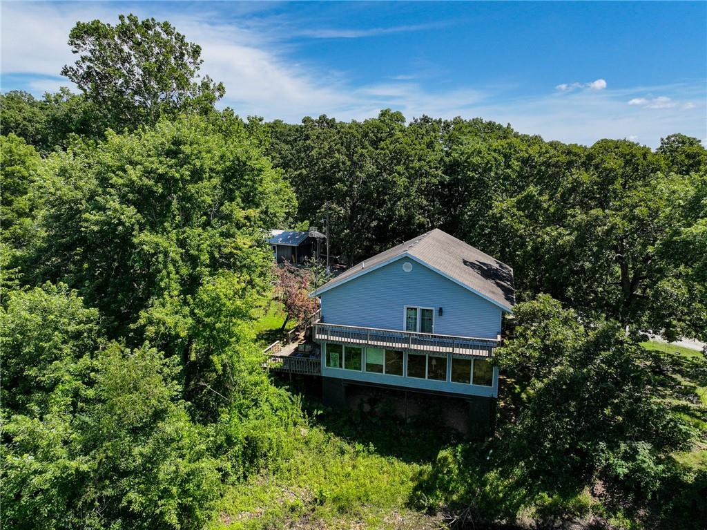 Home for sale Osceola Missouri Discover this spacious 4-bedroom, 3-bathroom home situated on 7.5± acres just minutes from Truman Lake in beautiful St. Clair County. This 2-story home with a basement offers peaceful country living with lake access nearby and abundant outdoor recreation. The main living room features large bay windows overlooking a private pond, offering daily views of local wildlife. The main suite includes a generous bathroom and private access to a back deck that spans the rear of the home—ideal for relaxing or entertaining. A large screened-in front porch provides the perfect space to enjoy your morning coffee or unwind in the evenings. House for sale St. Clair County MO The home is equipped with geothermal components (not currently operational), giving the next owner the opportunity to restore energy-efficient heating and cooling. The property is accessed via a gravel road that ends at the Osage arm of Truman Lake, with several public boat ramps just minutes away—perfect for fishing and boating enthusiasts. Additional features include a detached shop with a workshop and tool shed, offering excellent storage and workspace. The private well was updated in 2024 with a new pressure tank and piping. With plenty of room for hunting, gardening, or starting a hobby farm, this property is ideal for those seeking rural freedom and functionality. Located just a short drive to Osceola or Warsaw for everyday necessities, and approximately 1.5 hours from Kansas City or Springfield for major services and shopping.
