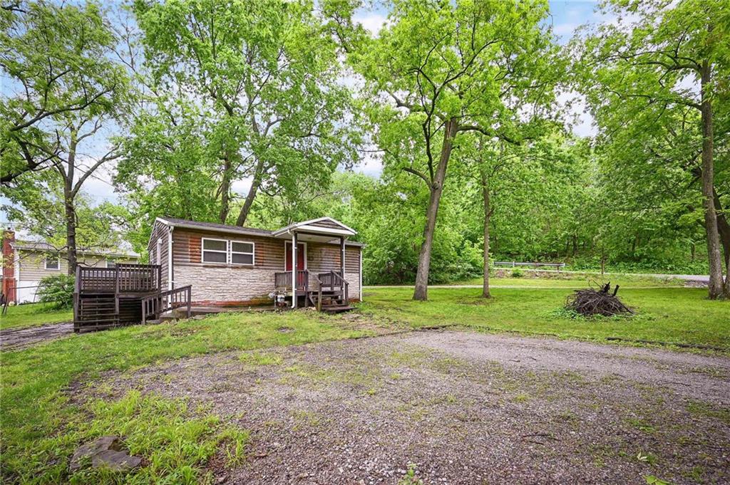 This home is the perfect way to experience lake living at a VERY low price.  This Lotawana Bungalow sits on 2-level first-tier lots and offers an inexpensive lake getaway.  Or it could easily be a wonderful building lot. There is plenty of room to build a garage, or you could add on to the existing home.  Loads of trees create a canopy & give a park-like ambiance for your peaceful lake getaway. Easy level access to lake & easy hwy access. There is 14' X 9' swim dock in nice water. This home needs TLC. Come and check it out!!!
